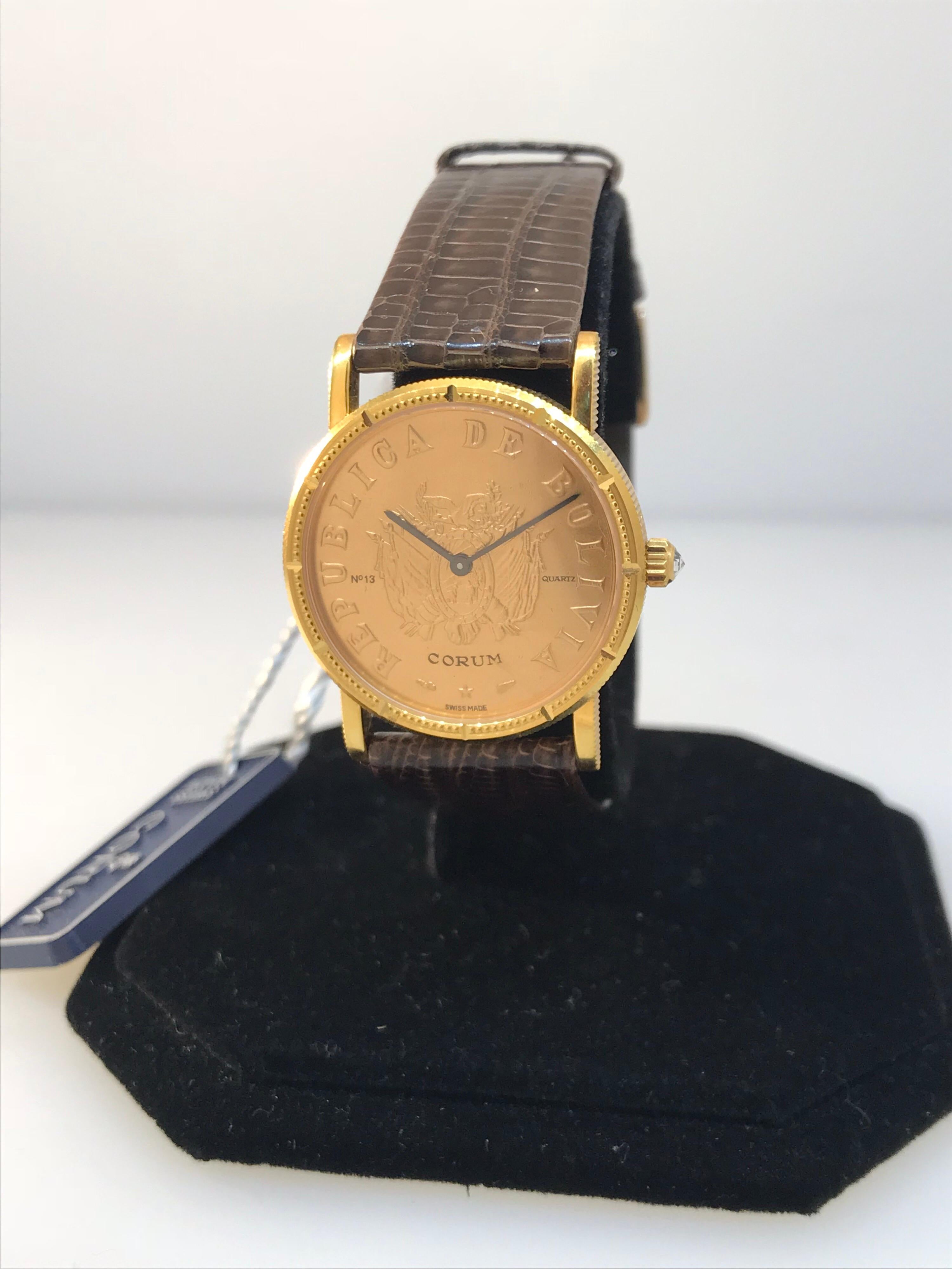 Corum Coin Ladies Watch

Model Number: 4414756

100% Authentic

New / Old Stock

Comes with a generic watch box

18 Karat Yellow Gold Case

Case Diameter: 28mm

Brown Leather Band

Tang Buckle

Last known retail was $11,900