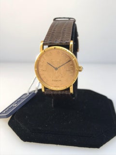 Montre Corum Coin à quartz en or jaune et cuir marron, pour femmes 4414756, neuve