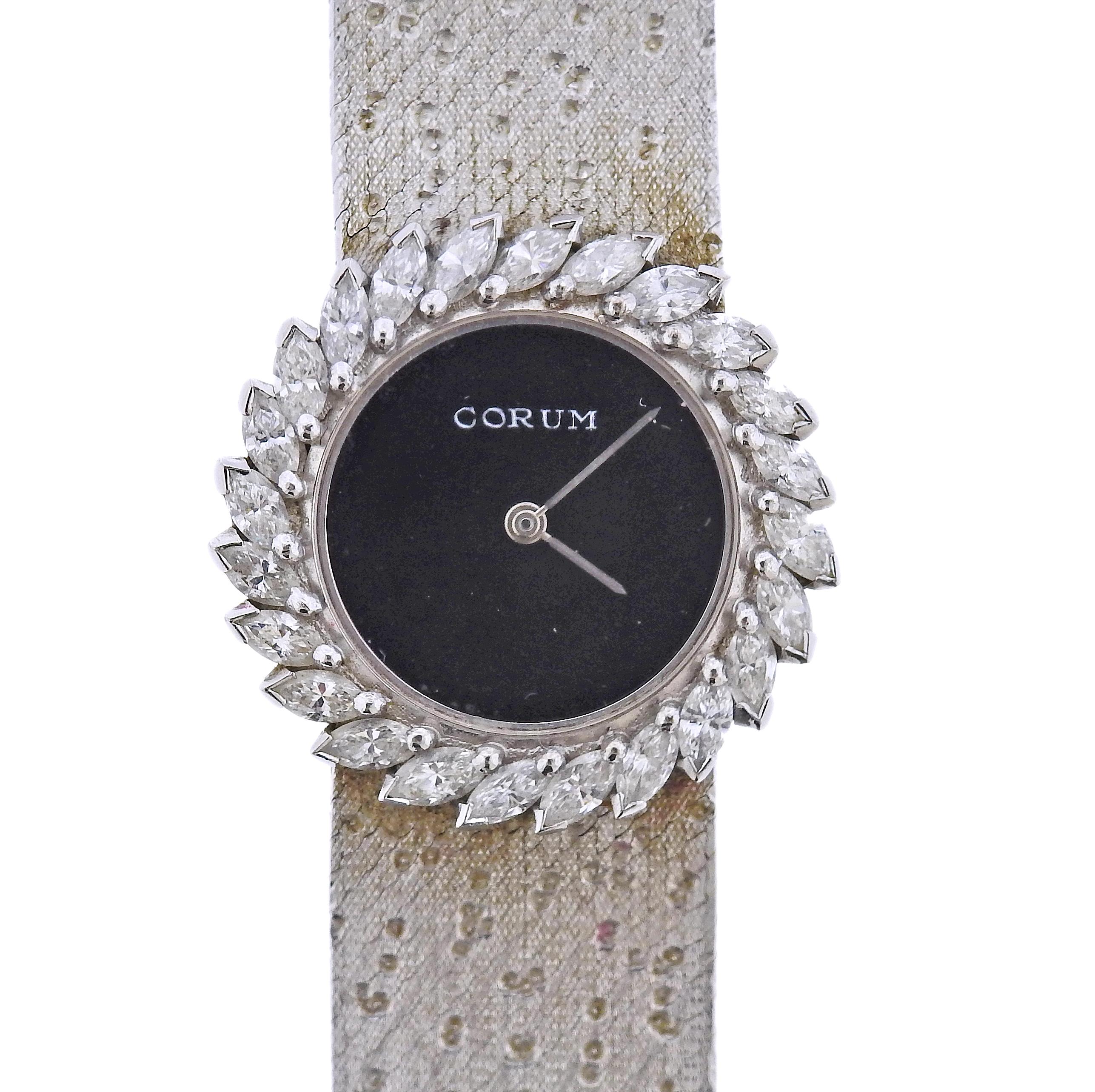 Classic Corum 18k white gold watch, with black Corum dial, case decorated with approx. 2.40ctw in diamonds. Case - 28mm in diameter. Bracelet is 7