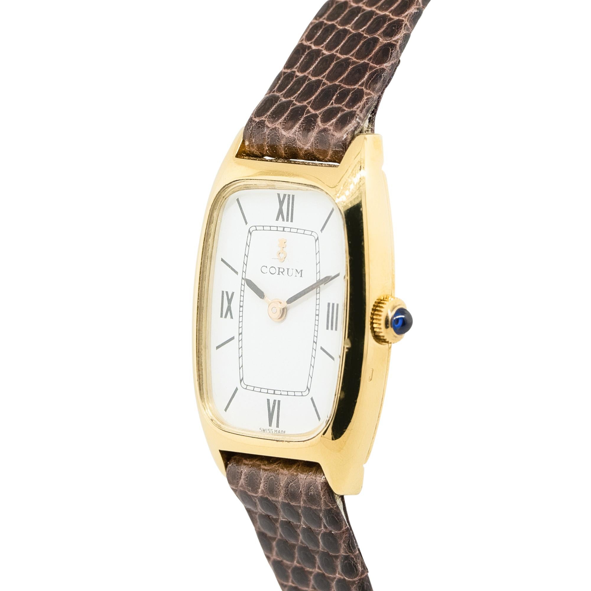 Brand: Corum
Reference: 173624
Case Material: 18k Yellow Gold Case
Case size: 21mm x 6.5mm x 27mm
Dial: White Dial with Black Roman Numerals
Bezel: 18k Yellow Gold
Bracelet: Brown Lizard 2 Piece Strap
Movement: Quartz
Size: Will fit a 7