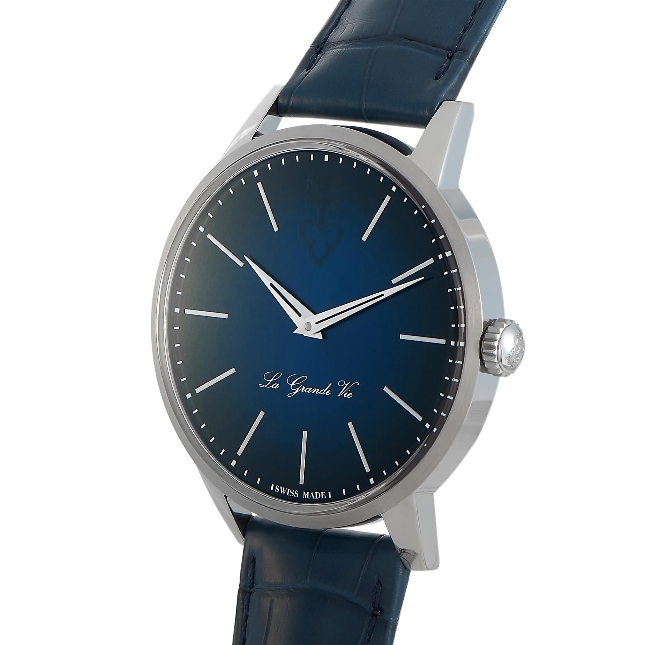 The Corum Heritage La Grande Vie watch, reference number 082.750.04/OF03, is a member of the esteemed “Heritage” collection.
 
 This timepiece comes with a 42 mm titanium case that boasts see-through back. On the blue dial, two central hands