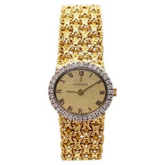 Montre Corum pour femme en or jaune et blanc 18 carats avec lunette en diamants