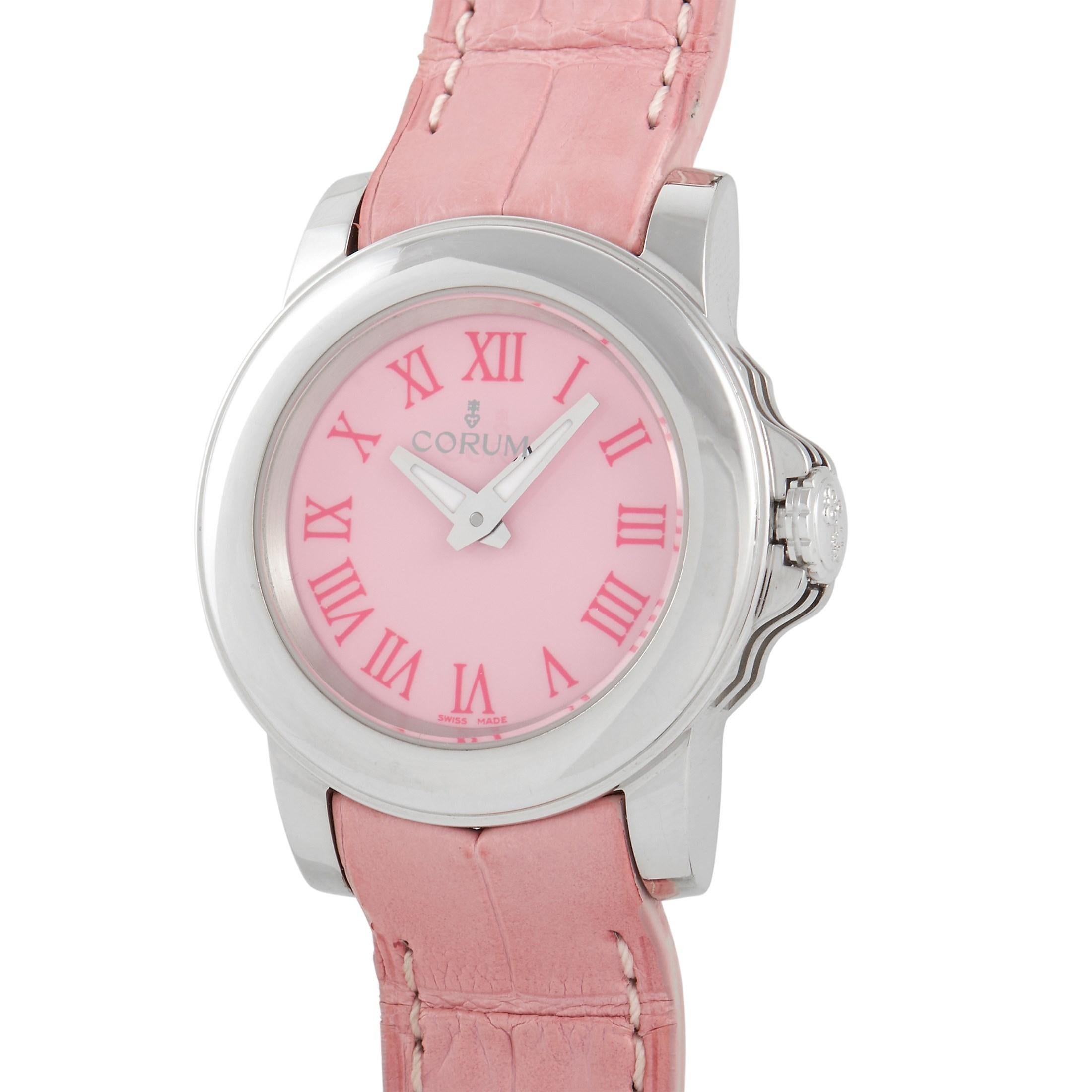 The Corum Pink Ladies Watch possesses an undeniable sense of charm. 

This Swiss-made watch features a round case crafted from 18K white gold. On the pink dial, you’ll find Roman numeral hour markers and luminous silver-toned hands. It’s attached to