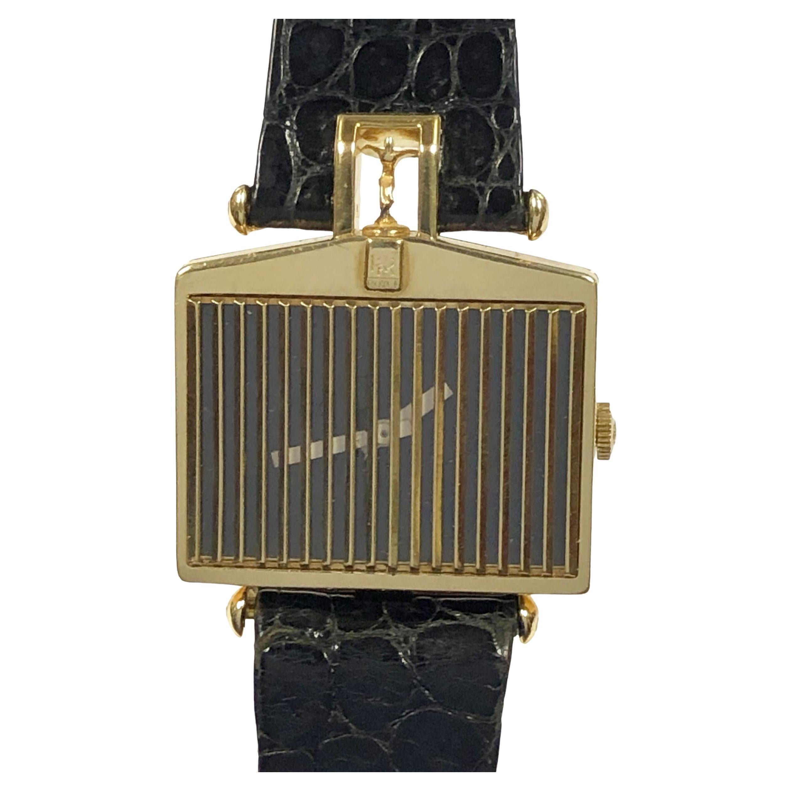 Circa 1980 Corum Rolls-Royce Wrist Watch, 29 x 26 MM 18K Yellow Gold 2 piece Case, Having a Gold Grill over the crystal and the Spirit of Ecstasy 