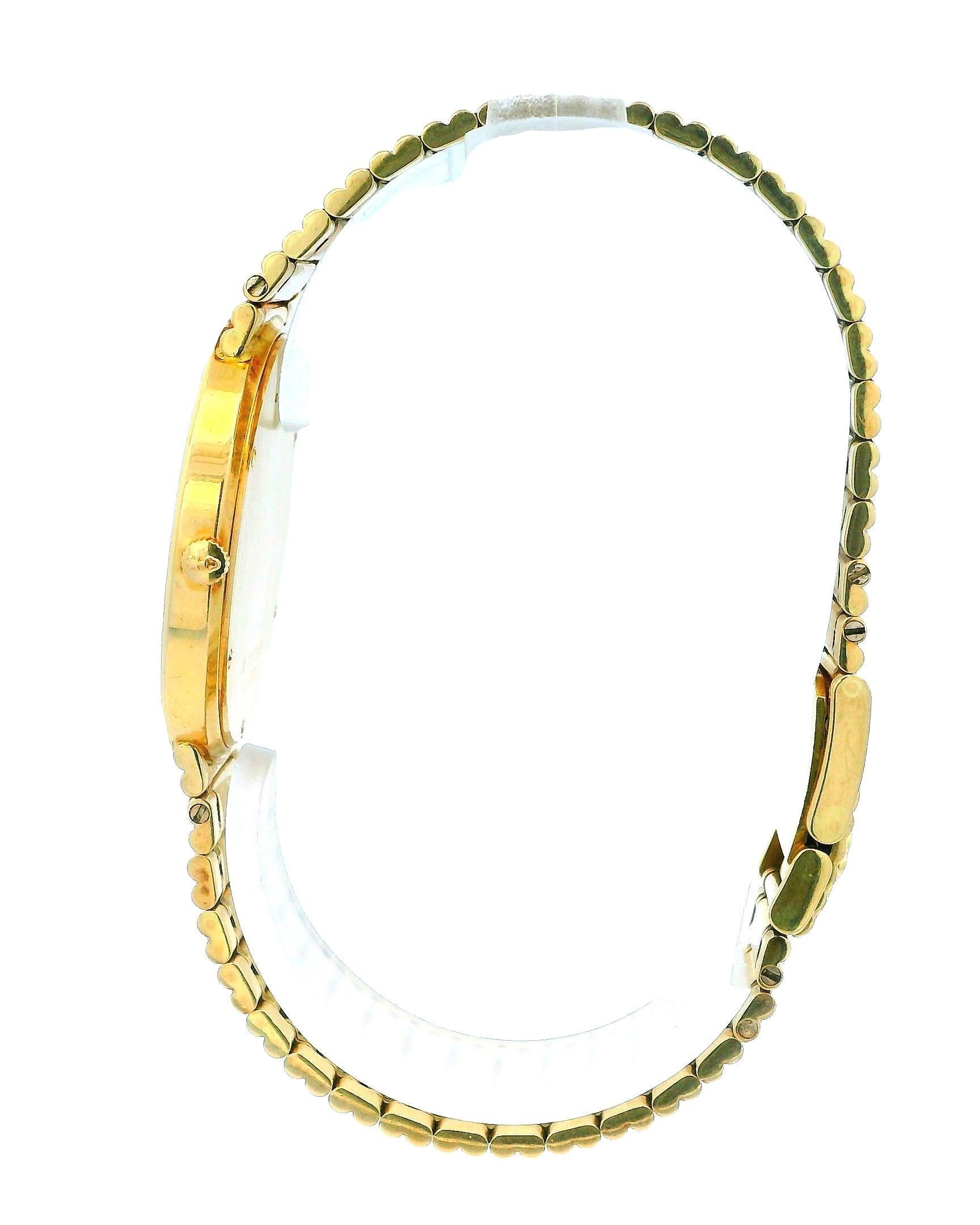 Corum Romulus 18K Yellow Gold Ruby Bag Bezel Reeded Link Bracelet In Good Condition For Sale In Great Neck Plaza, NY