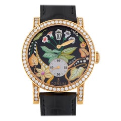 Montre Corum en or rose avec cadran à fleurs et diamants 154.201.65