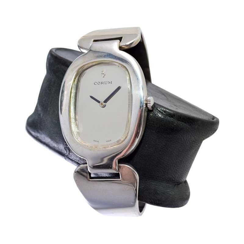 FACTORY / HOUSE: Corum Watch Company
STYLE / REFERENCE: Clip On / Cuff Watch 
METAL / MATERIAL: Sterling Silver
DIMENSIONS: Length 42mm  X Width 28mm
CIRCA: 1970's
MOVEMENT / CALIBER: Manual Winding / 17 Jewels / High Grade Hand Finished
DIAL /