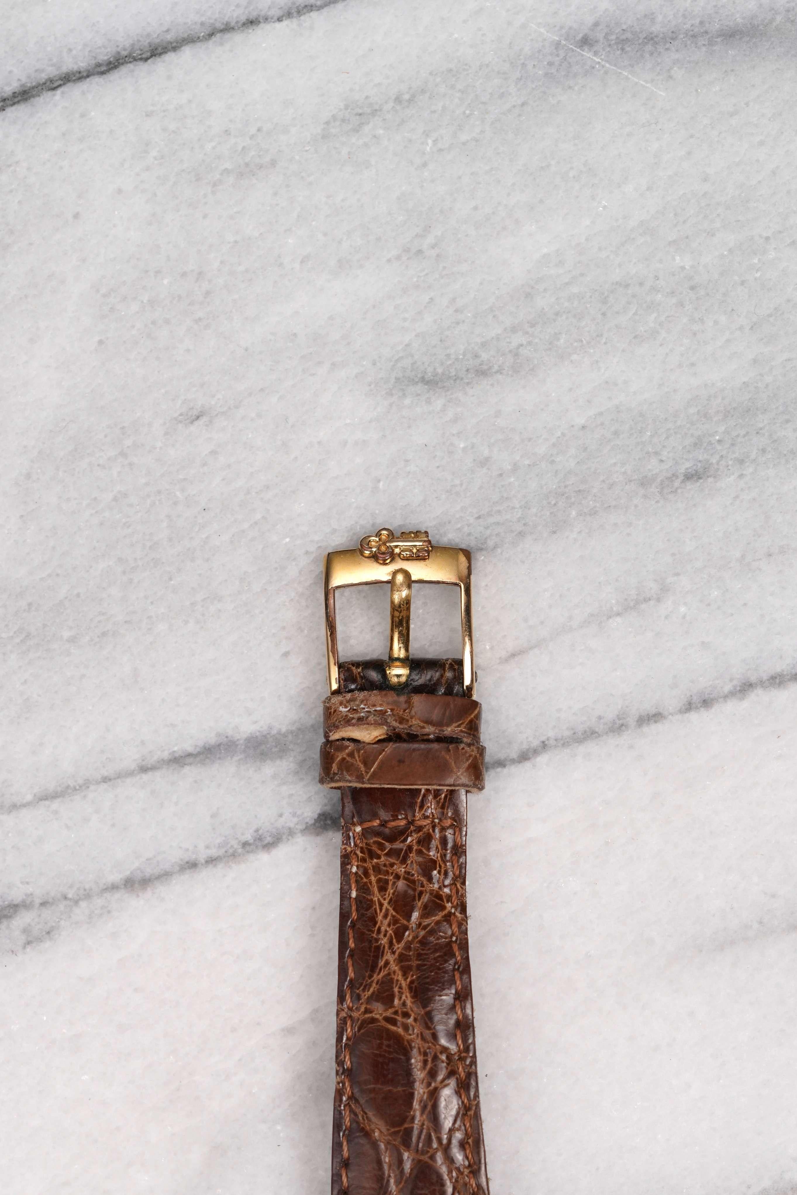 Here's a vintage Corum Tank brown pheasant feather dial in 18K yellow gold, manual wind, from the late 70s to early 80s. Keeps great time and is fully functional. Measurements include a 24x30mm case size and 18mm lug width. It’s on an aftermarket