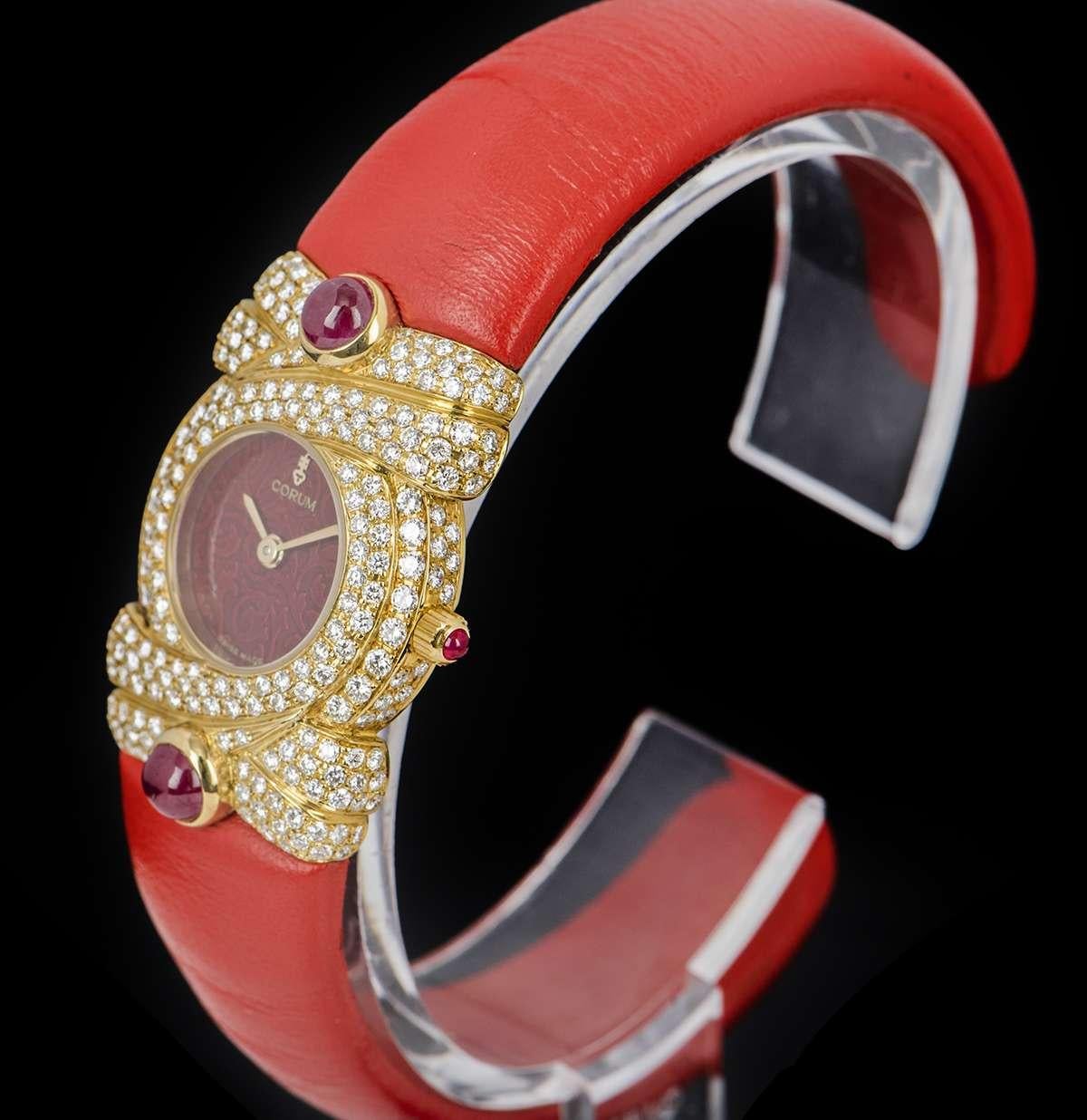 gold watch red dial