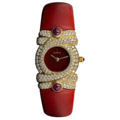 Corum Montre habillée non portée à cadran rouge en or jaune 18 carats sertie de diamants, pour femmes NOS