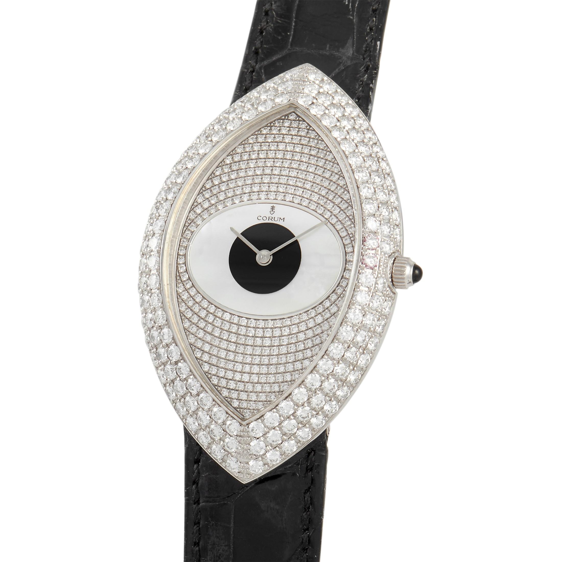 Rarely you'll find a lady's watch as stunningly attractive as this. The Corum 18K White Gold Diamond Eye-Shaped Ladies' Watch is a one-of-a-kind timepiece designed with a marquise-shaped case. Displaying a glamorous glare is an eye-like dial