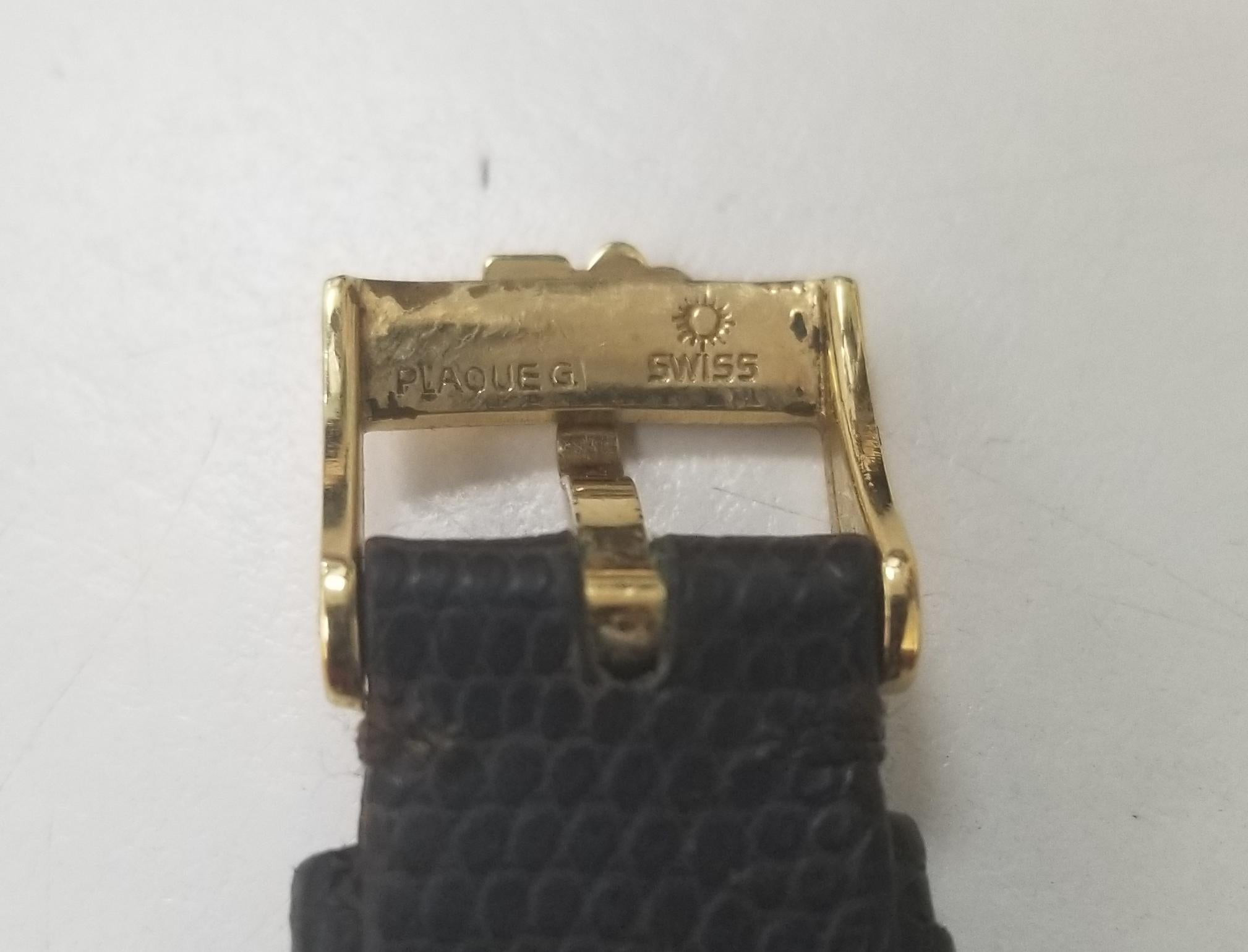 Corum Damenuhr aus Gelbgold mit 10 Dollar Münze und Diamanten Jahr 1902 (Cabochon)