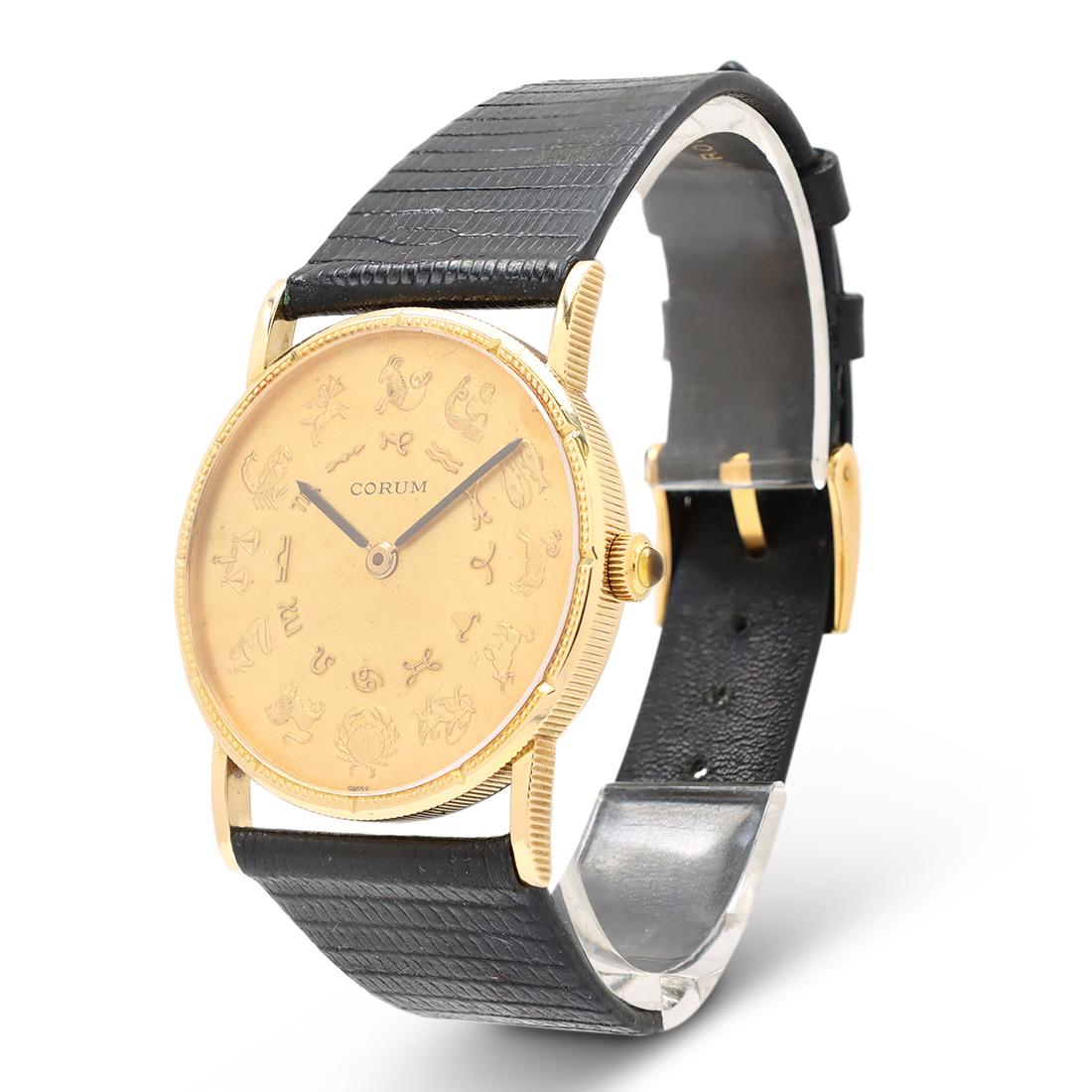 Authentic vintage Corum Astrological wristwatch crafted in 18 karat yellow gold. Distinctive astrological constellations are featured on the outer track of dial with zodiac symbols on the inner track. Alternating hobnail bezel, coin-edge case, and