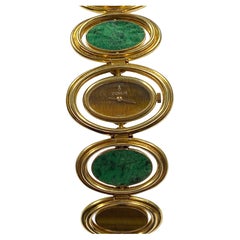 Montre-bracelet réversible Corum en or jaune avec œil de tigre et malachite, années 1980