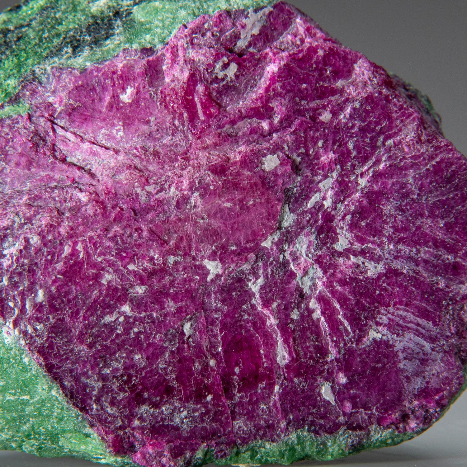 From Longido, Arusha, Tanzania.

Large hexagonal ruby crystal, the red-pink gem variety of the mineral species corundum, in green zoisite matrix.

Weight: 1.8 lbs, Dimensions: 3.5 x 2 x 3.5 inches.