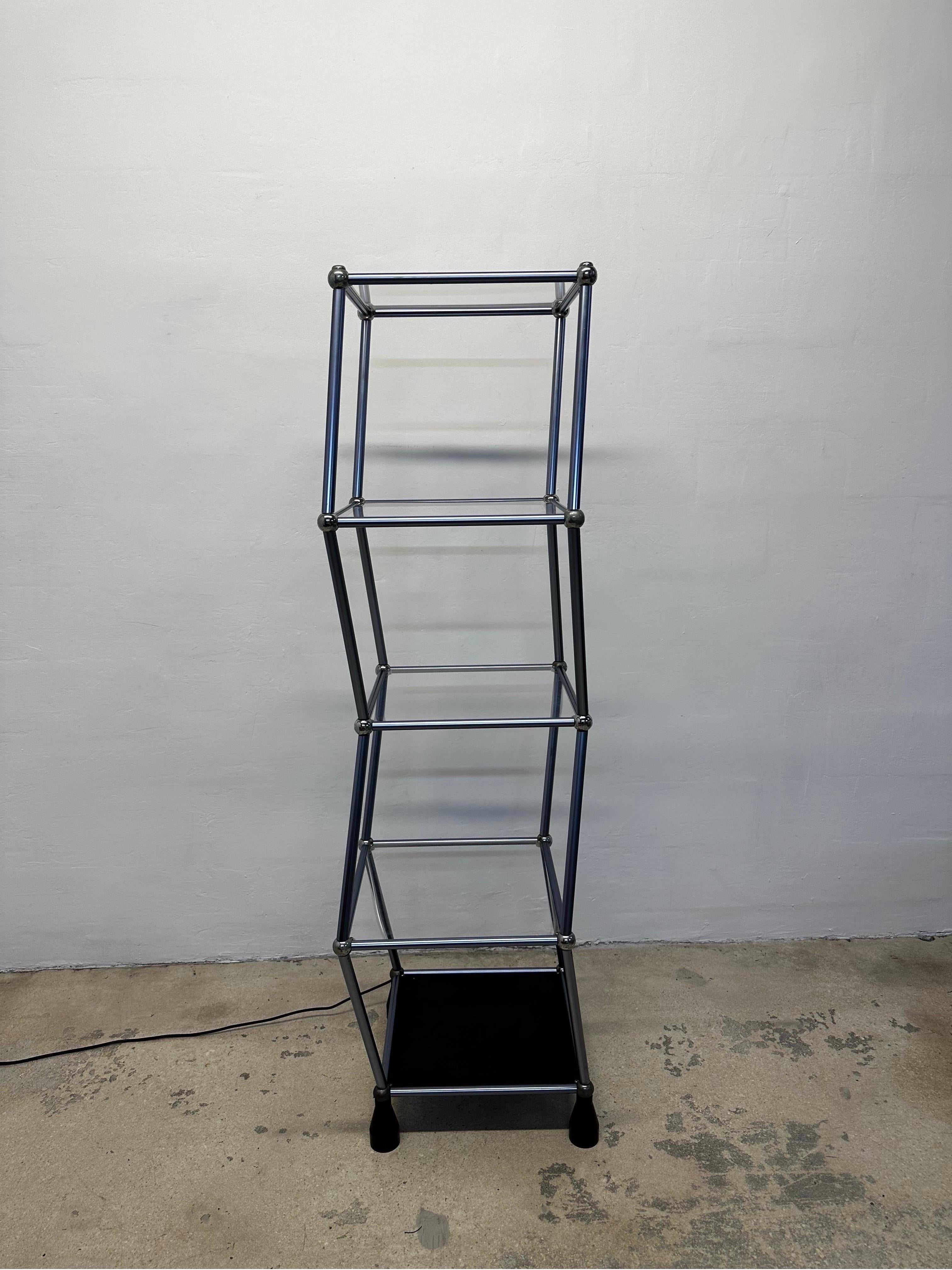 The kinetic dancing display shelves were originally designed by Cory Arcangel for use as product demonstrations. The acrylic shelves rest on rollers and are powered by a small motor under the unit that make the shelves literally dance.