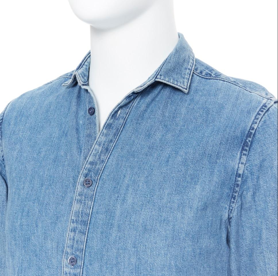 COS washed blue denim cotton long sleeve shirt XS 
Reference: CRTI/A00249 
Brand: COS 
Material: Cotton 
Color: Blue 
Pattern: Solid 
Closure: Button 
Made in: China 

CONDITION: 
Condition: Very good, this item was pre-owned and is in very good