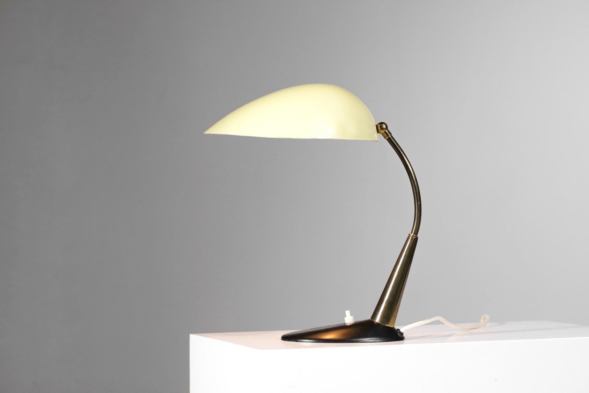 Desk lamp by German designer Cosack Leutchen from the 1950s. Black lacquered metal base, solid brass arm and yellow lacquered metal shade (original paint). Very nice vintage condition, please note traces of use and time on the whole and particularly