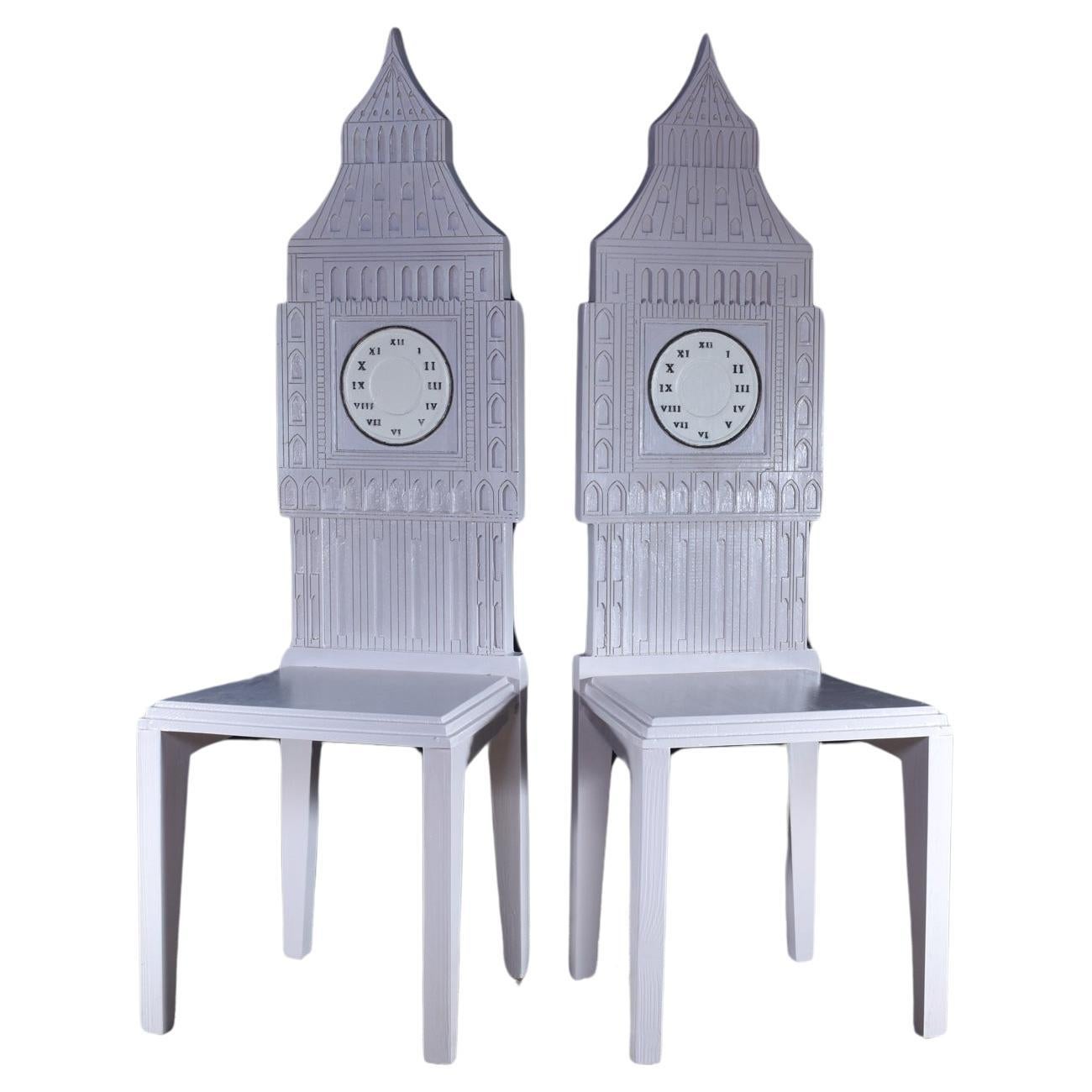 A towering pair of Big Ben chairs by the Italian designer Cosimo De Vita.

The chairs are hand crafted in Florence from solid Fir wood and finished in a light sandstone colour with cream and black detail. This iconic design of the Great Clock of