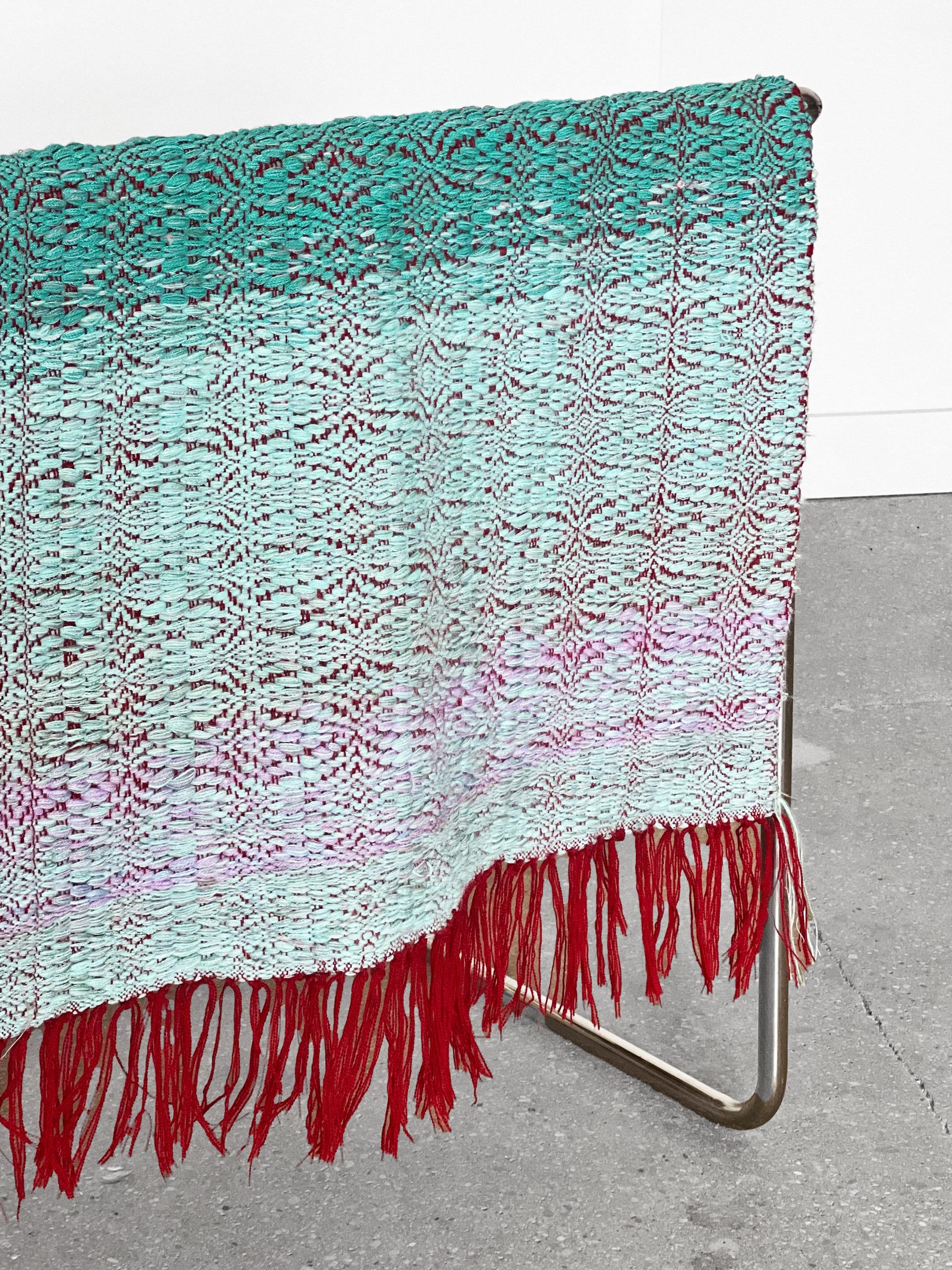 Handwoven throw/tapestry crafted with meticulous care from reclaimed fibers, cotton, and wool yarns. Soft and cozy throughout the piece and can be used functionally or aesthetically.

The intricate blend of textures and colors creates a visual