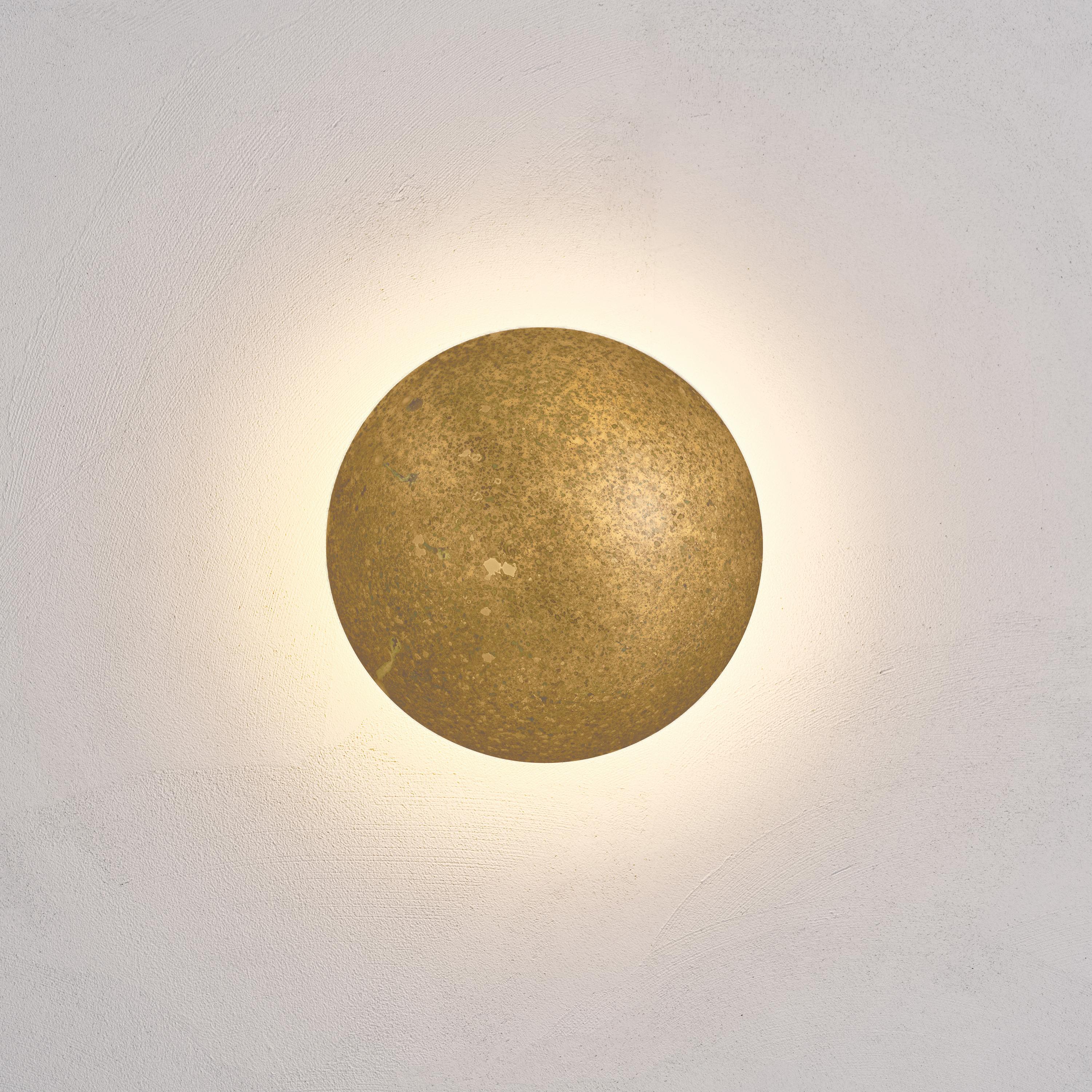 Cosmic 'Comet Oxidium 20' hand-crafted oxidised patinated brass wall light, sconce

Named after the astronomical object that signals a rebirth and new ideas, the ‘Comet’ pieces are achieved with skilful brass shaping and patina finishes that