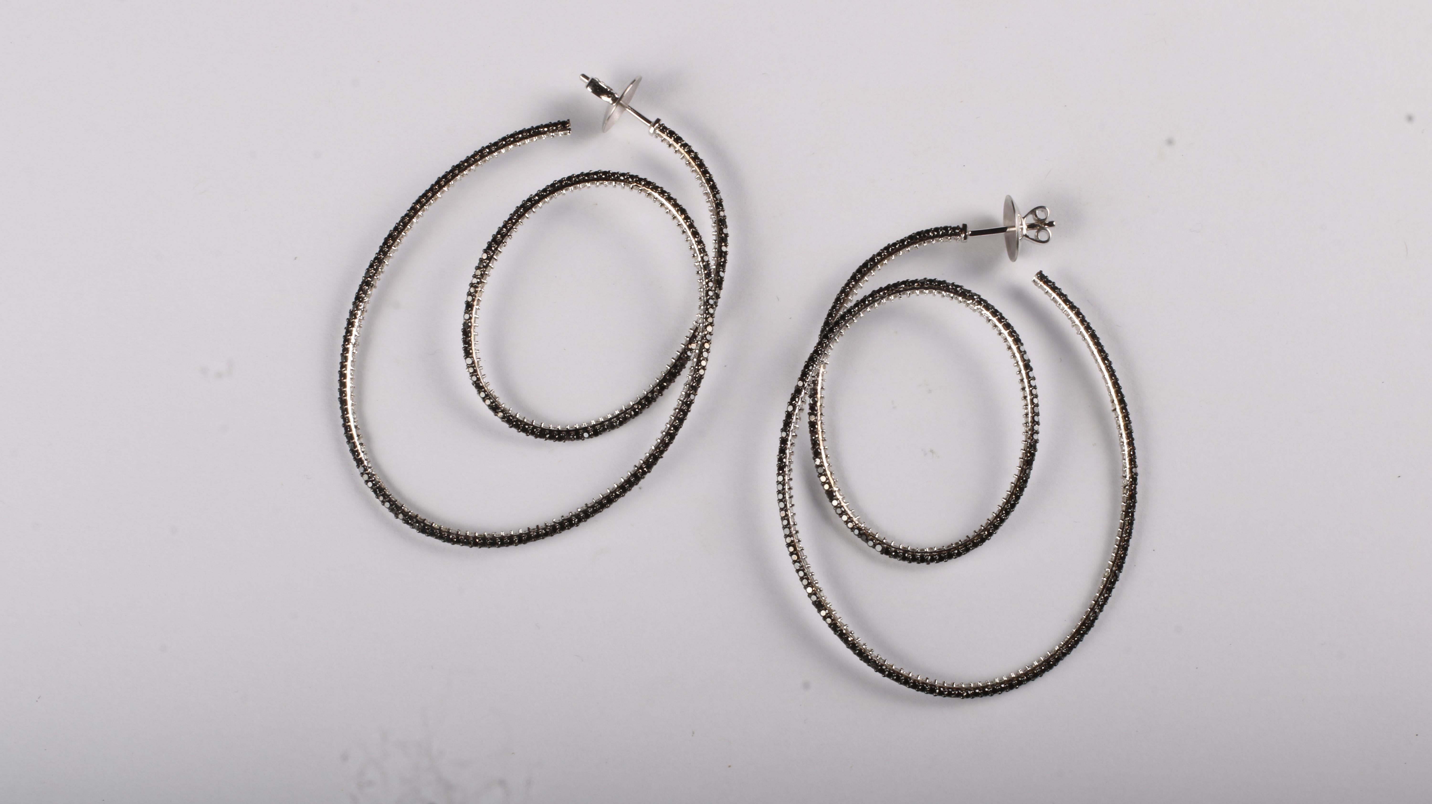 Contemporary Cosmic Dance Double Hoops with Black and White Diamonds For Sale