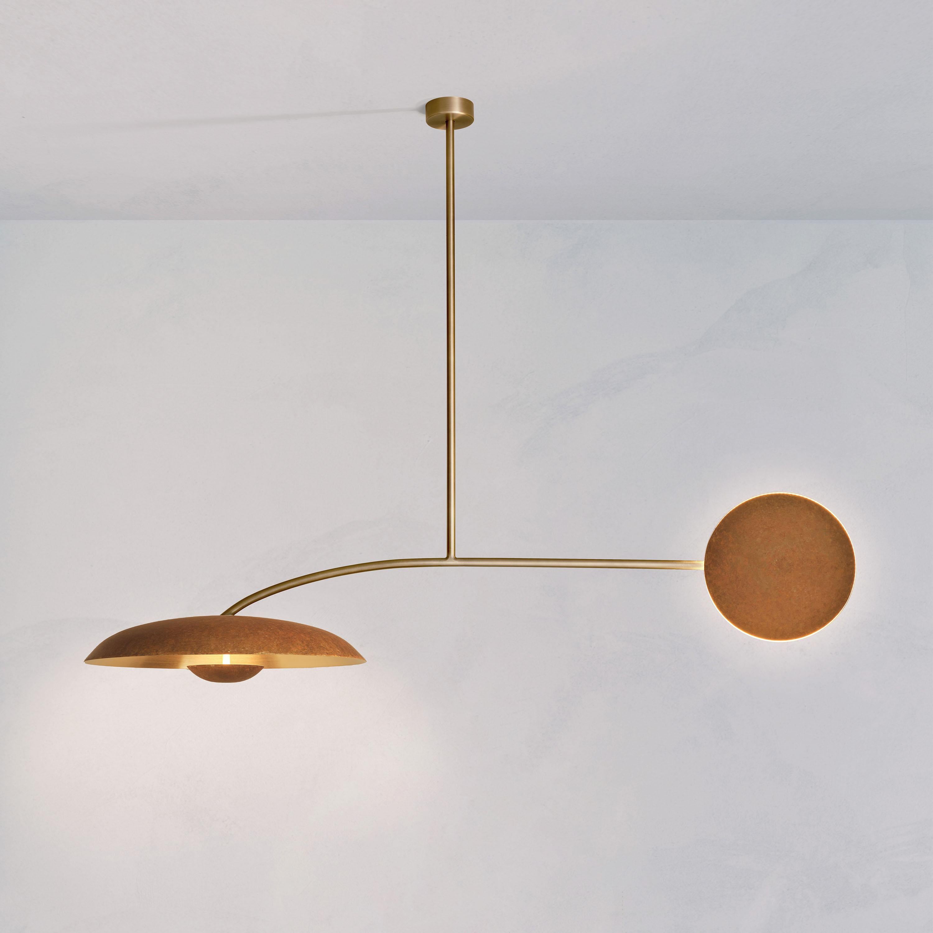Two lighting components harmoniously balanced, framing this unique ceiling light. Composed by patinated brass plates and finely brushed bronze framework, the Orbit Solo ceiling light is softly illuminated with LED elements from within.
 
This