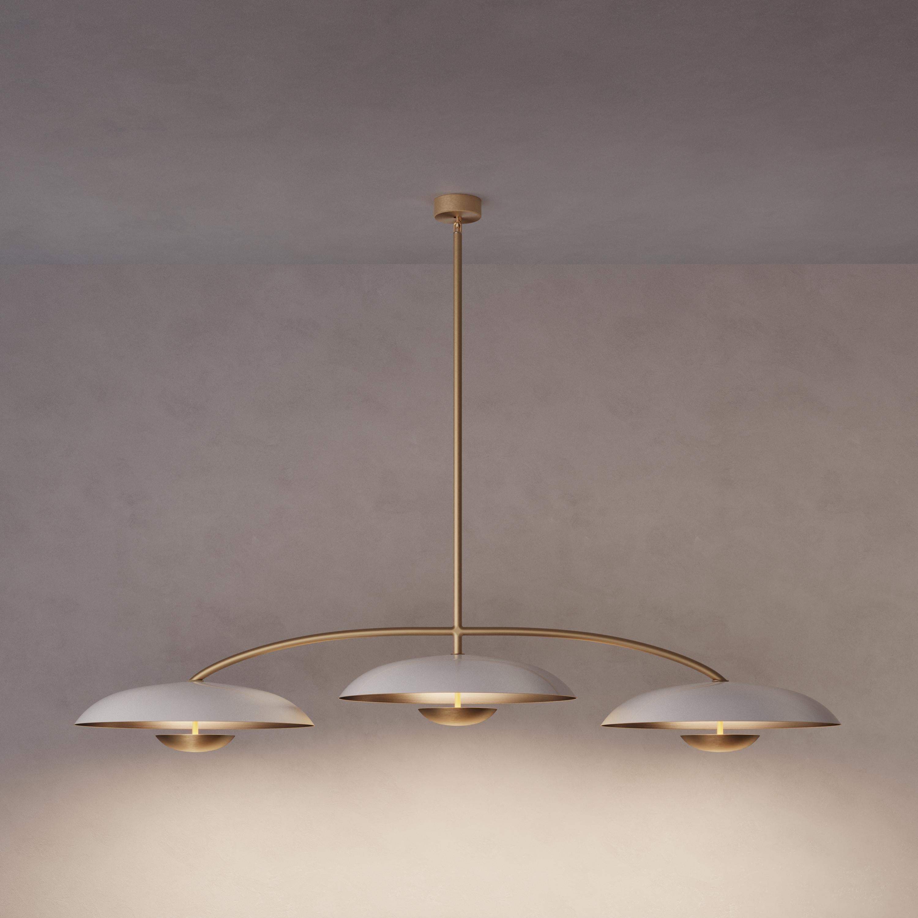 Trio for three, a unique ceiling light composed by a cluster of lighting components. Combining patinated brass plates and finely brushed brass framework, the Orbit Trio ceiling light is softly illuminated with LED elements from within.
 
This