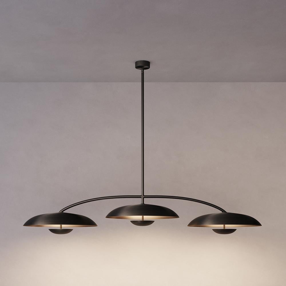 Trio for three, a unique ceiling light composed by a cluster of lighting components. Combining patinated brass plates and finely brushed bronze framework, the Orbit Trio ceiling light is softly illuminated with LED elements from within.
 
This