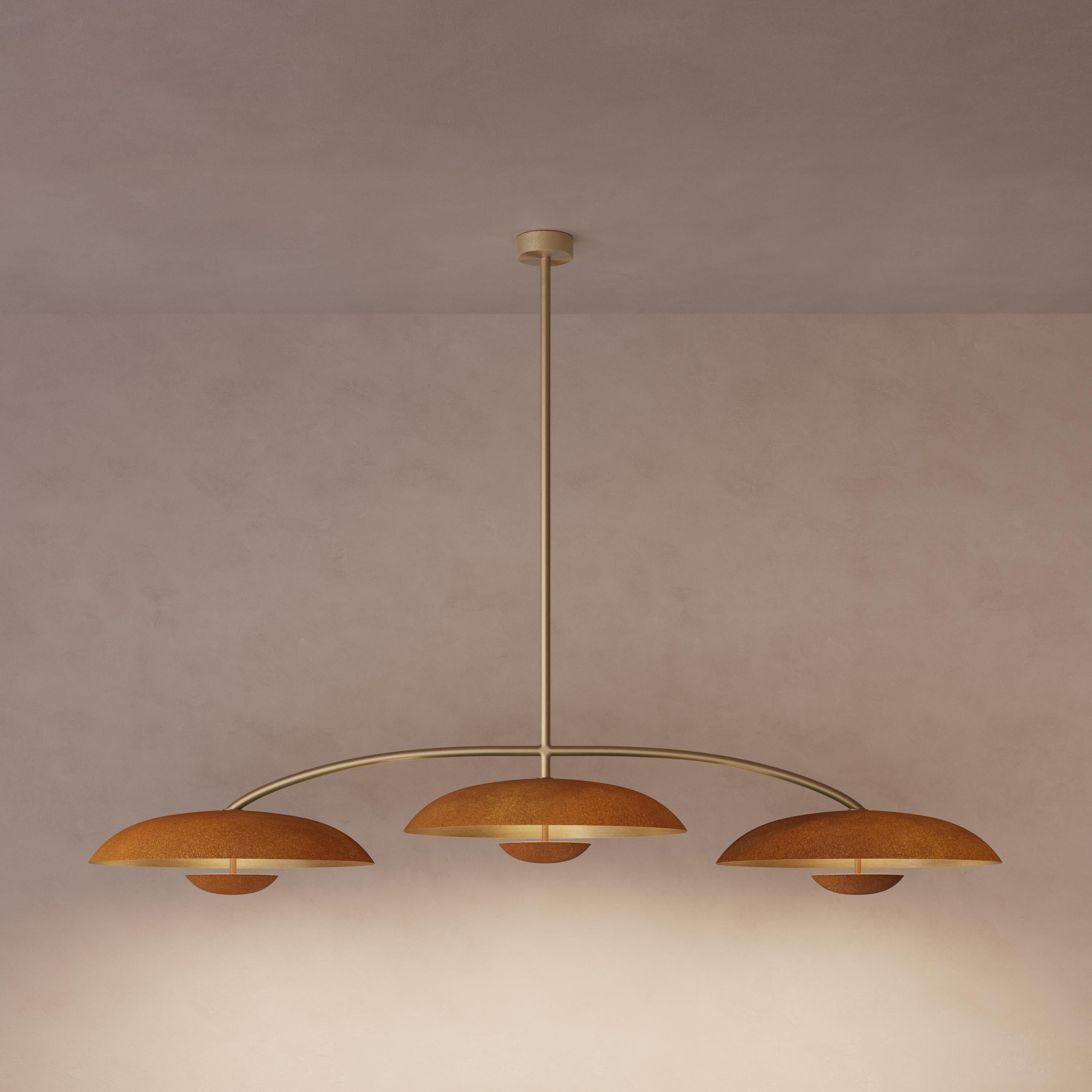 Trio for three, a unique ceiling light composed by a cluster of lighting components. Combining patinated brass plates and finely brushed bronze framework, the Orbit Trio ceiling light is softly illuminated with LED elements from within.
 
This