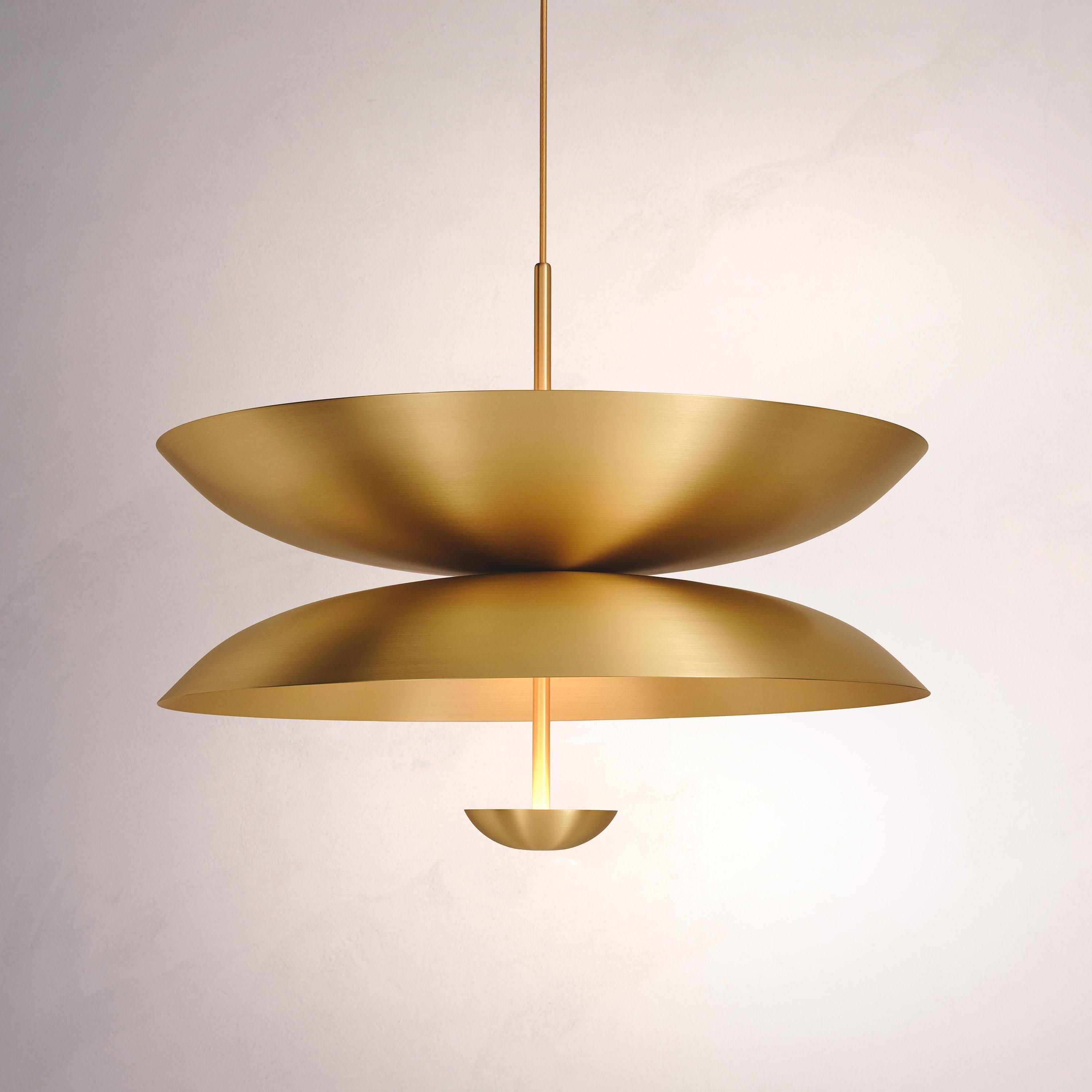 Inspired by planet-like shapes and textures, the Cosmic collection plays with both metal properties and a selection of patina finishes.
 
The Pendant Duo Sol is composed of three carefully hand-spun brass plates and preserves the beautiful texture