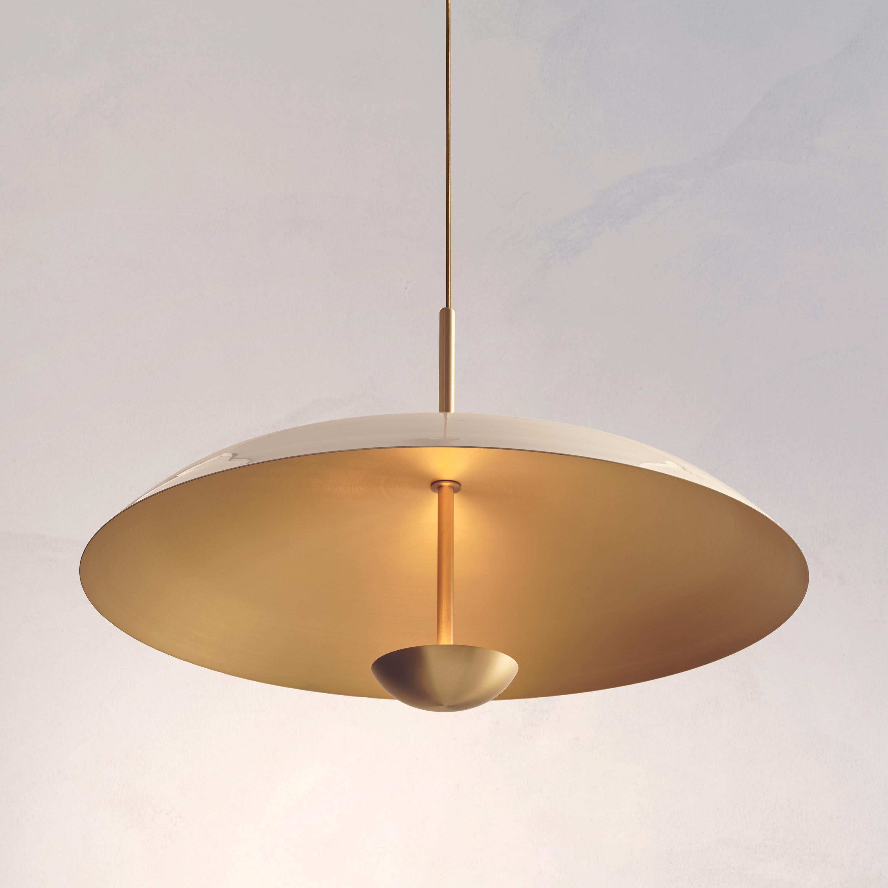 Two finely hand-spun brass plates make up this pendant light, finished in a gloss or matt white lacquer to create this unique appearance. Please note the process is random and each plate has a slightly variant finish. The light is projected into the