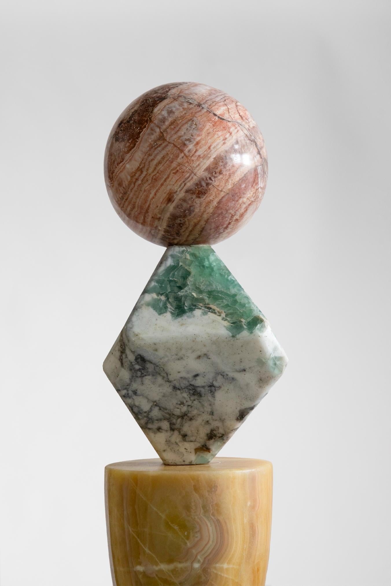 Materials: Queretaro black marble, jade onyx, blue calcite, lava stone, travertine, pineapple onyx, fluorite, dragon onyx.
Cosmic Relics totems are limited edition of 8 + 2AP, unique variations; each sculpture has a different set of stones making