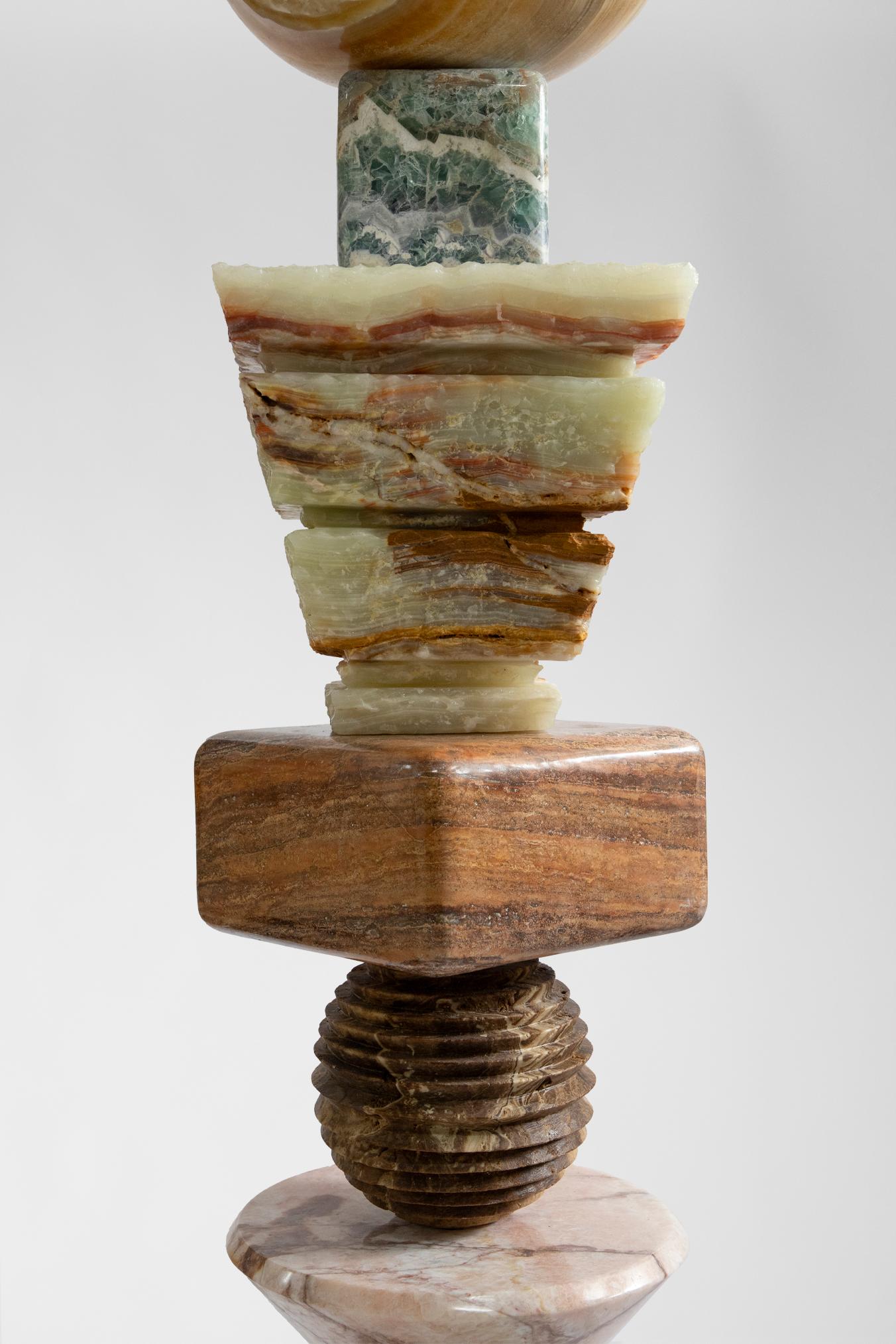 Materials: Lava stone, pink onyx, brown onyx, red travertine, green
olive onyx, fluorite, pineapple onyx, botanical onyx.
Cosmic Relics totems are limited edition of 8 + 2AP, unique variations; each sculpture has a different set of stones making