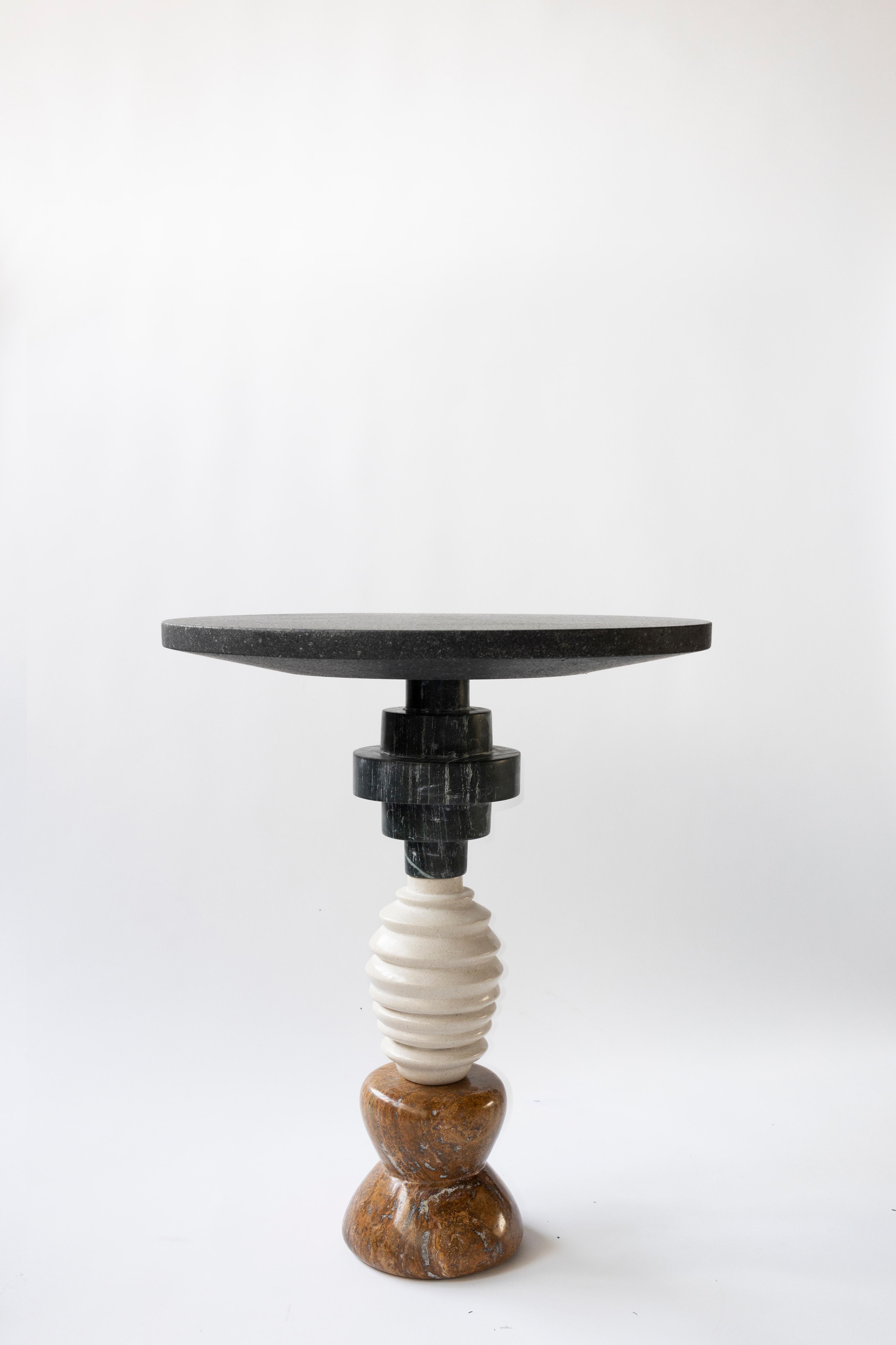 Materials: Red travertine, travertine, green Alps marble, lava stone, stainless steel
Indoors
Hand crafted Side table

Inspired by the enduring legacy of observing the cosmos, 'Cosmic Traces' evolves from the essence of 'Cosmic Relics.' While totems