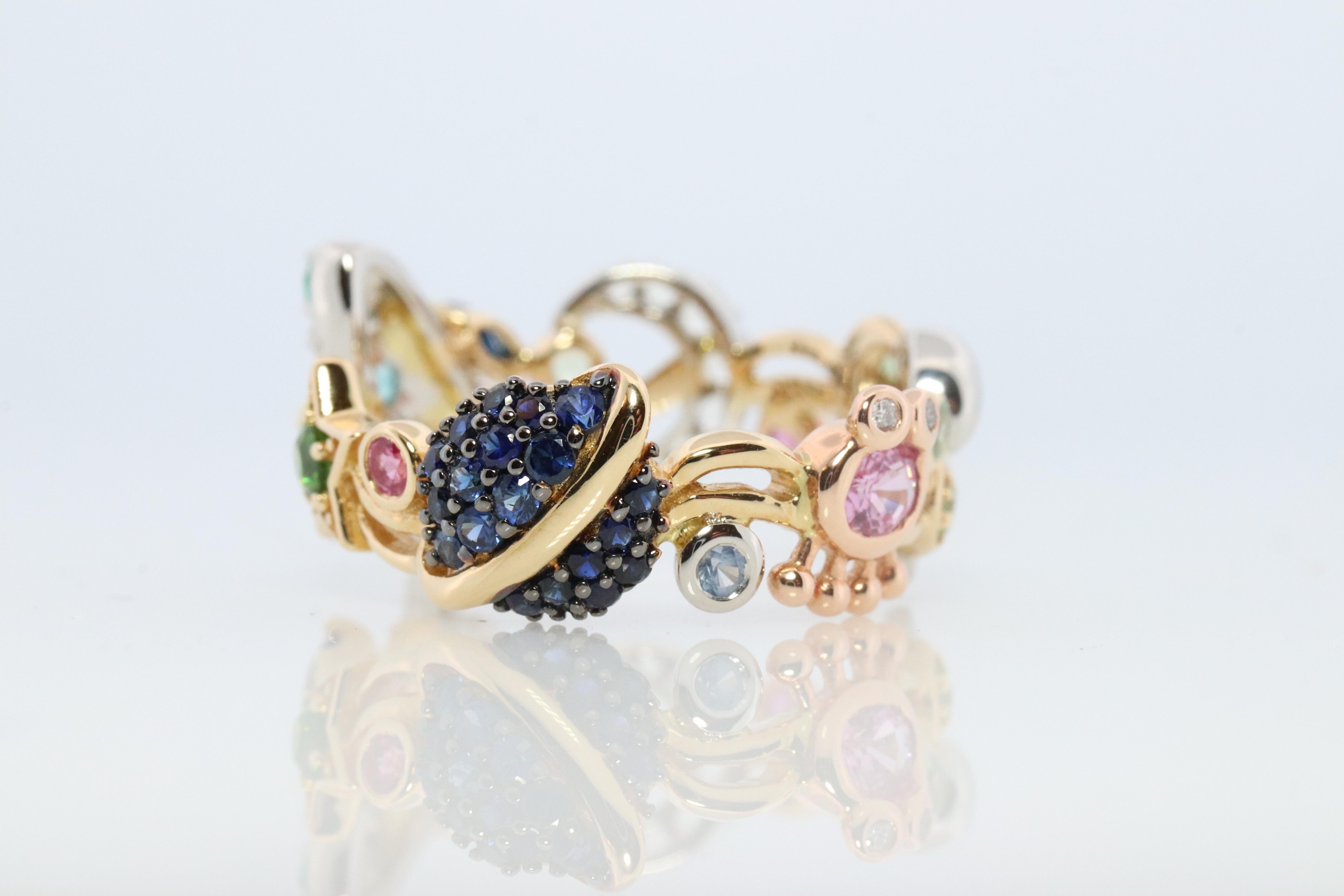 Bespoke one of a kind piece of Jewelry

Space Theme Band

Band consisting of a rocket, space ship, planets, stars, and moon.

18k Yellow Gold with Platinum PT950
Various color sapphires. 

Details:
5.8 grams total weight
8mm to 10mm Wide

Size 7.25