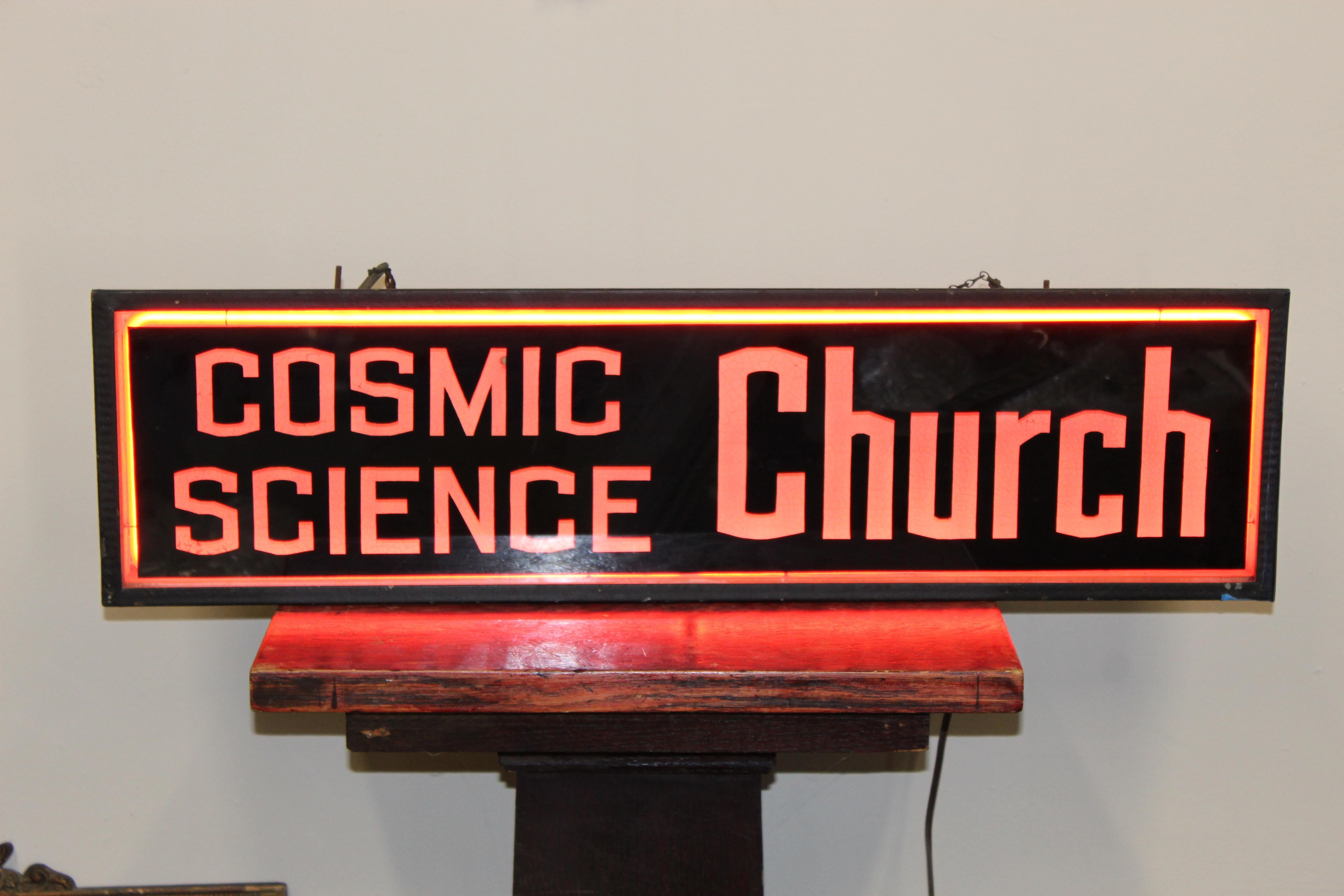 Original condition, lights up with red neon. Glass Advertising counters top sign. Right side of sign has blue tape helping frame stay intact. Some blemishes and patina on the housing.