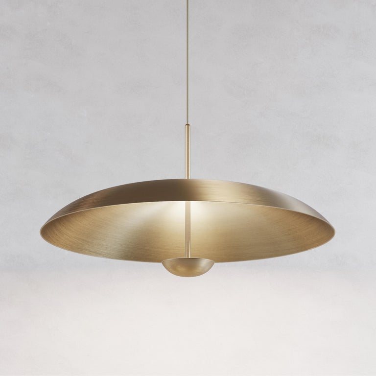 Composed by two carefully hand-spun brass plates, the Sol Pendant preserves the beautiful texture and quality of fine brass. Light is projected into the shade before reflecting out, illuminating without creating a glare. 

This light fixture is