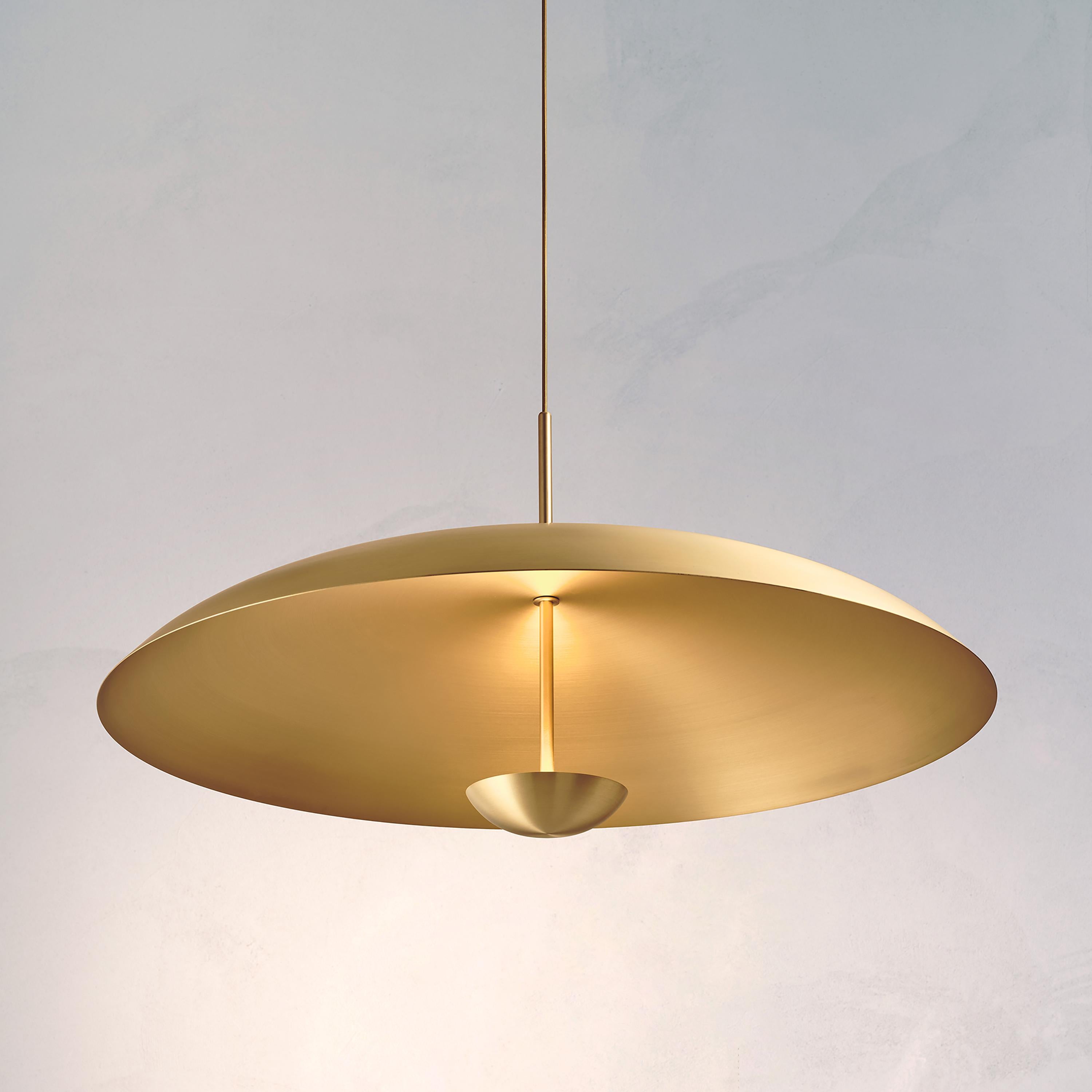 Composed by two carefully hand-spun brass plates, the Sol Pendant preserves the beautiful texture and quality of fine brass. Light is projected into the shade before reflecting out, illuminating without creating a glare. 

This light fixture is