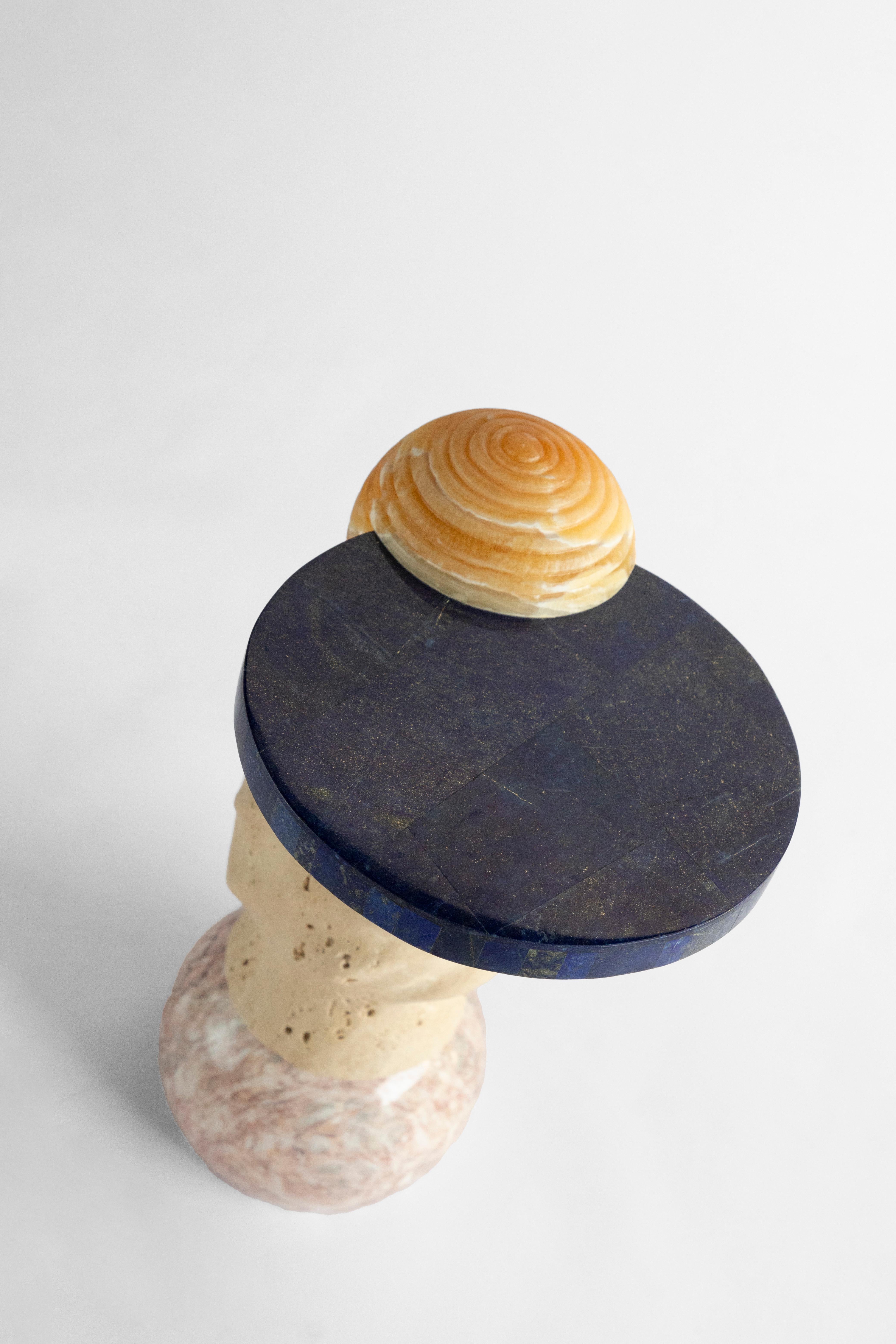 Materials: Pink marble, travertine, pineapple onyx and Lapislazuli
Hand crafted Side table
Limited edition of 15

Inspired by the enduring legacy of observing the cosmos, 'Cosmic Traces' evolves from the essence of 'Cosmic Relics.' While totems