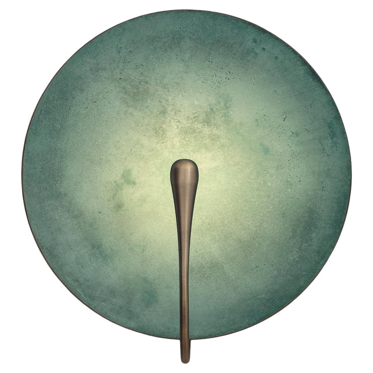 Inspired by the beautiful textures of nature, a verdigris patina is applied on a hand-spun brass plate to create this unique finish. Please note that with each process being slightly random, every result is variant.

Softly illuminated with