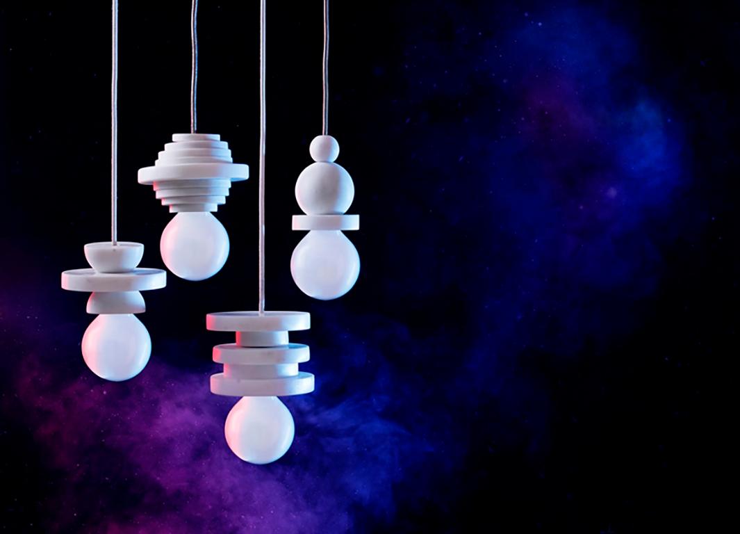 COSMICITY is a collection of unique marble pendant lights, where geometric shapes are cut in lightweight forms. These are combined into totemic figuries of white marble or pink & green marble hues, evoking a sense of playfulness and