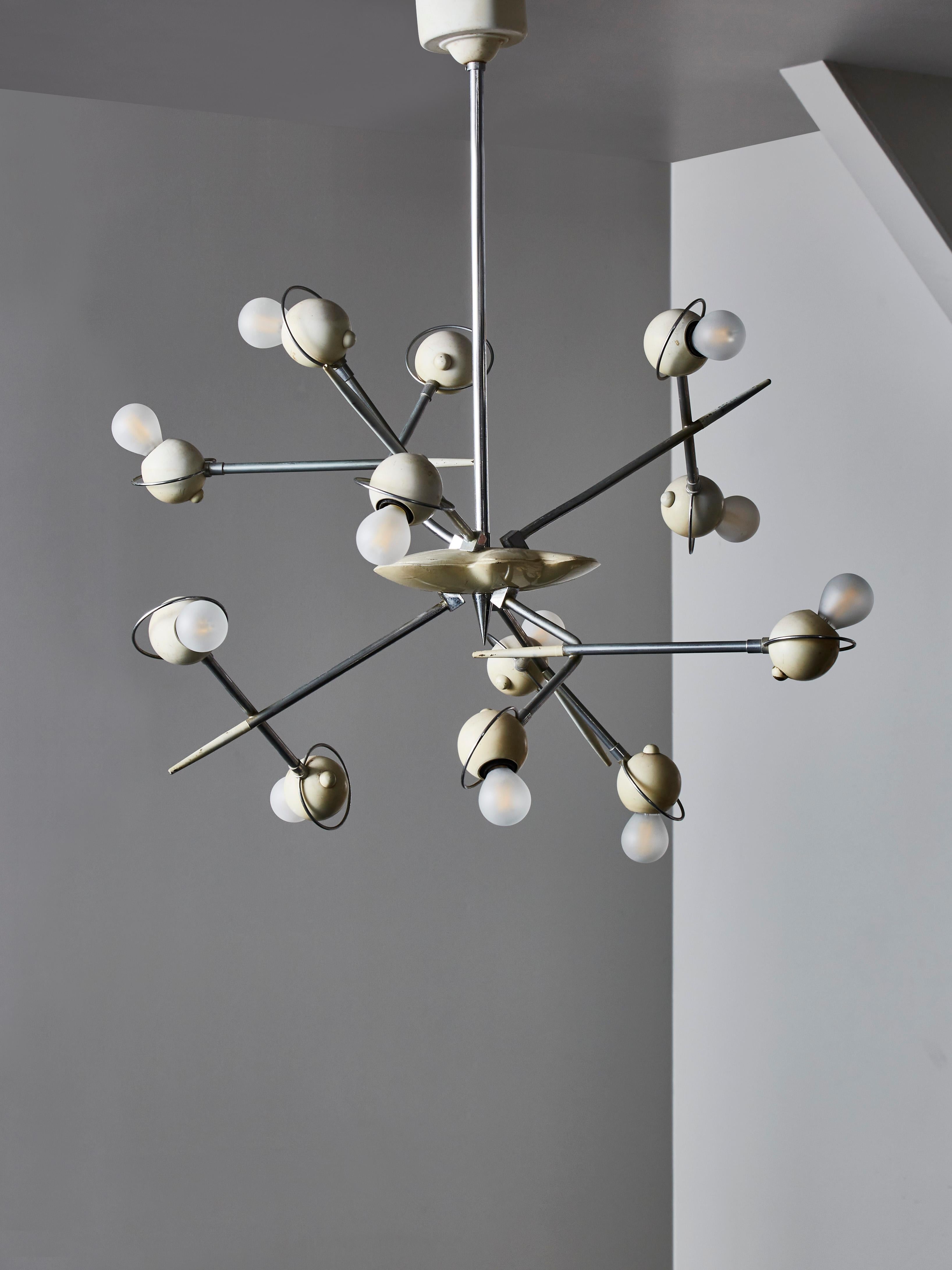 Unique looking Cosmo chandelier designed by Oscar Torlasco for Lumi in the 1960s.

This chandelier has twelve randomly placed arms of light and is made of lacquered aluminium and nickeled brass.

Good vintage condition.