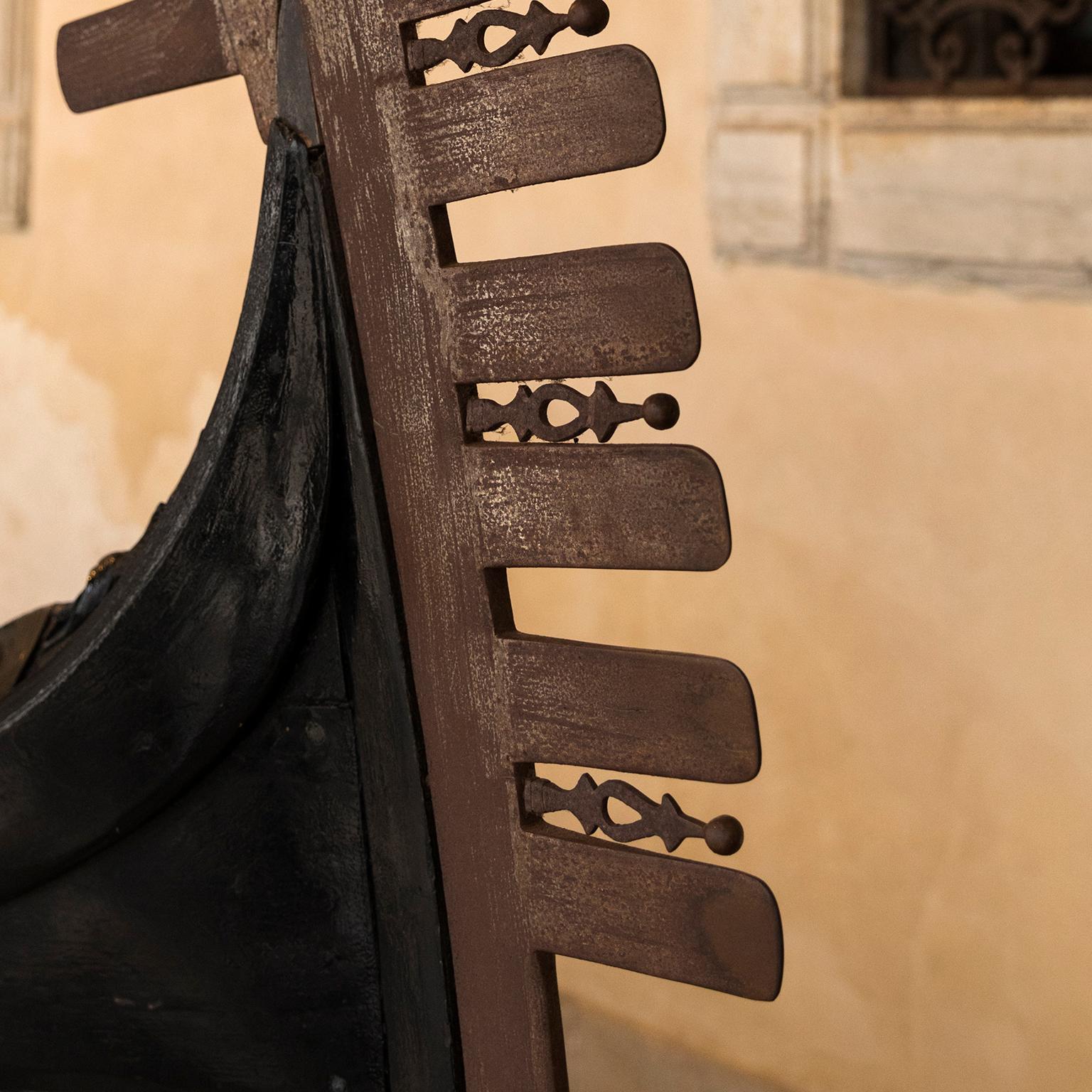 Gondola, “Capello del Doge”, Doges Palace, Venice, Italy 2018
Photograph by Cosmo Condina. Bow of an antique gondola.
Archival pigment print 19 X 12.6 in.  Edition of 10. This is # 3/10 in the edition.

Close up detail of an antique gondola at the