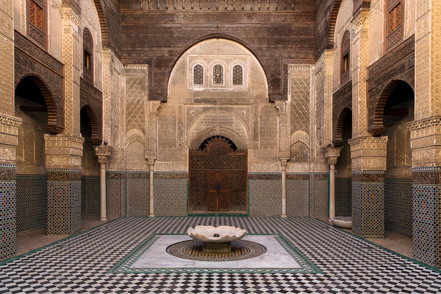 Islamic architectural detail of the Medersa courtyard, Fez, Morocco, 2016
Photograph by Cosmo Condina. Courtyard of the Medersa.
Archival pigment print 19 X 12.6 in.  Edition of 10. This is # 3/10 in the edition.

The Bou Inania Medersa built