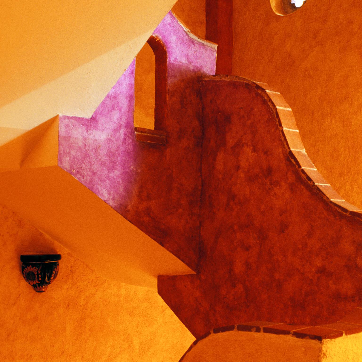 Secret Staircase, Mexico, 2009
Photograph by Cosmo Condina. Interior Staircase,  Playa del Carmen,  Mexico, 2009

Archival pigment print 19 X 12.6 in. Edition of 10. This is # 3/10 in the edition.

Colour photograph in beautiful warm tones of orange