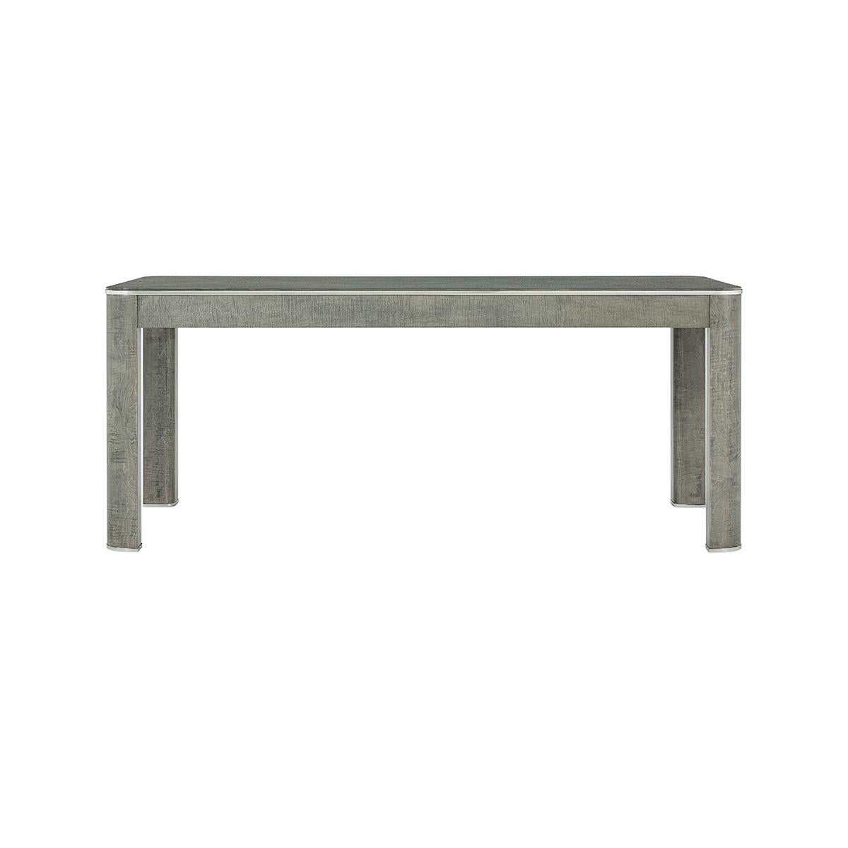 A welcoming and sophisticated work surface, A three-drawer writing table that warmly blends brushed stainless steel accents with maple veneer and layered oak.

Dimensions: 72