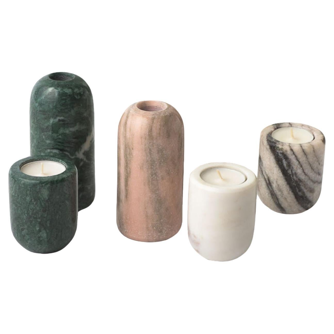 The Reversible Hand Carved Cosmos Marble Holder By Kunaal Kyhaan are the perfect accessories to add ambient lighting to an intimate dinner. Can be used for a regular long candle and a tea light candle when flipped. 
They come in 2 sizes and a