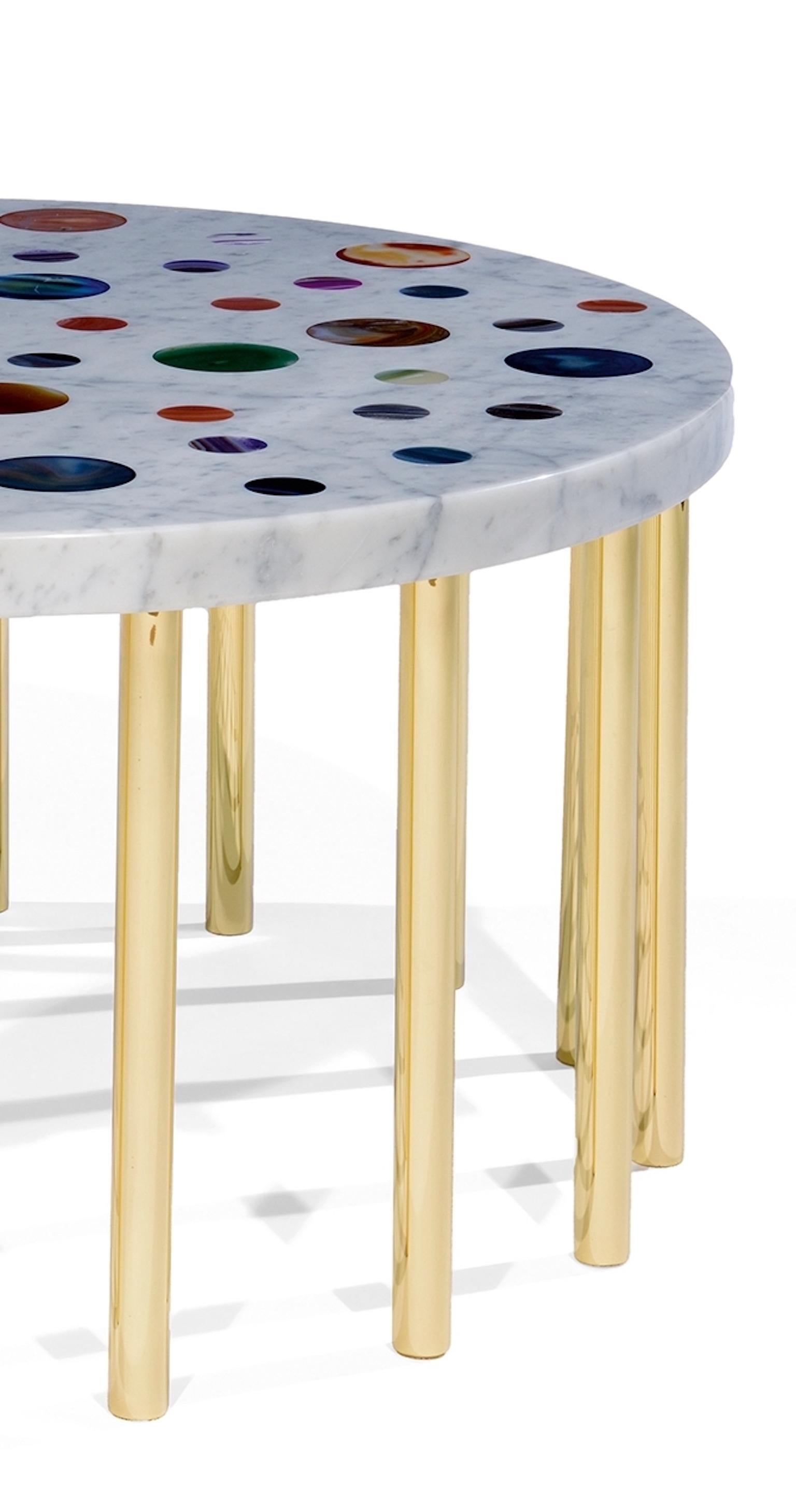 Table basse 'Cosmos' en marbre de Carrare avec des disques d'agate de différentes couleurs et avec seize pieds en laiton, conçue par Studio Superego pour les éditions Superego, en 2017.

Les éditions Superego sont nées en 2006, menant une activité