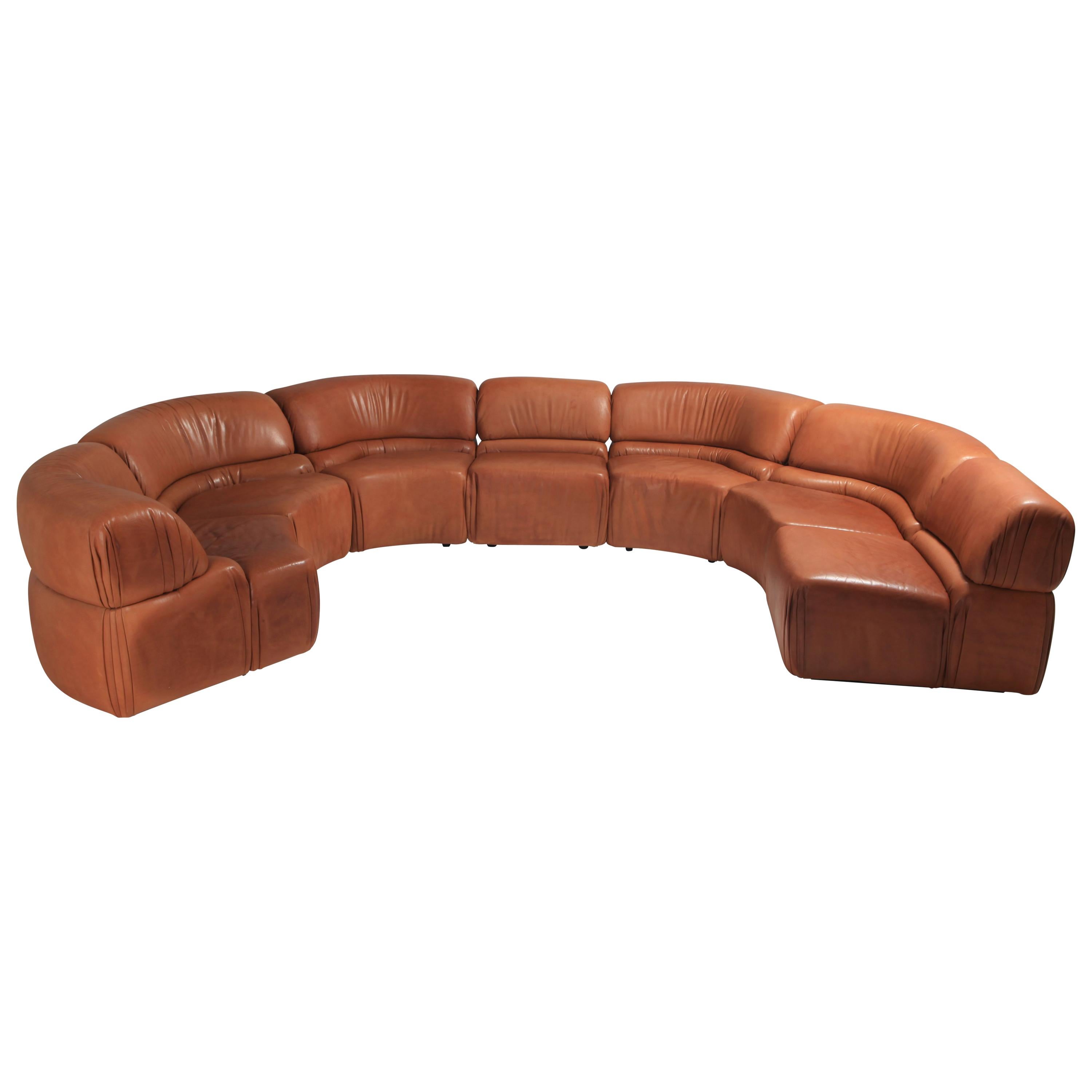 De Sede 'Cosmos' sofa in original cognac leather.

Iconic and stunning sectional sofa consisting of 7 pieces by Swiss leading luxury leather manufacturer De Sede.
A 1970s Mid-Century Modern high end piece in great condition.

De Sede once